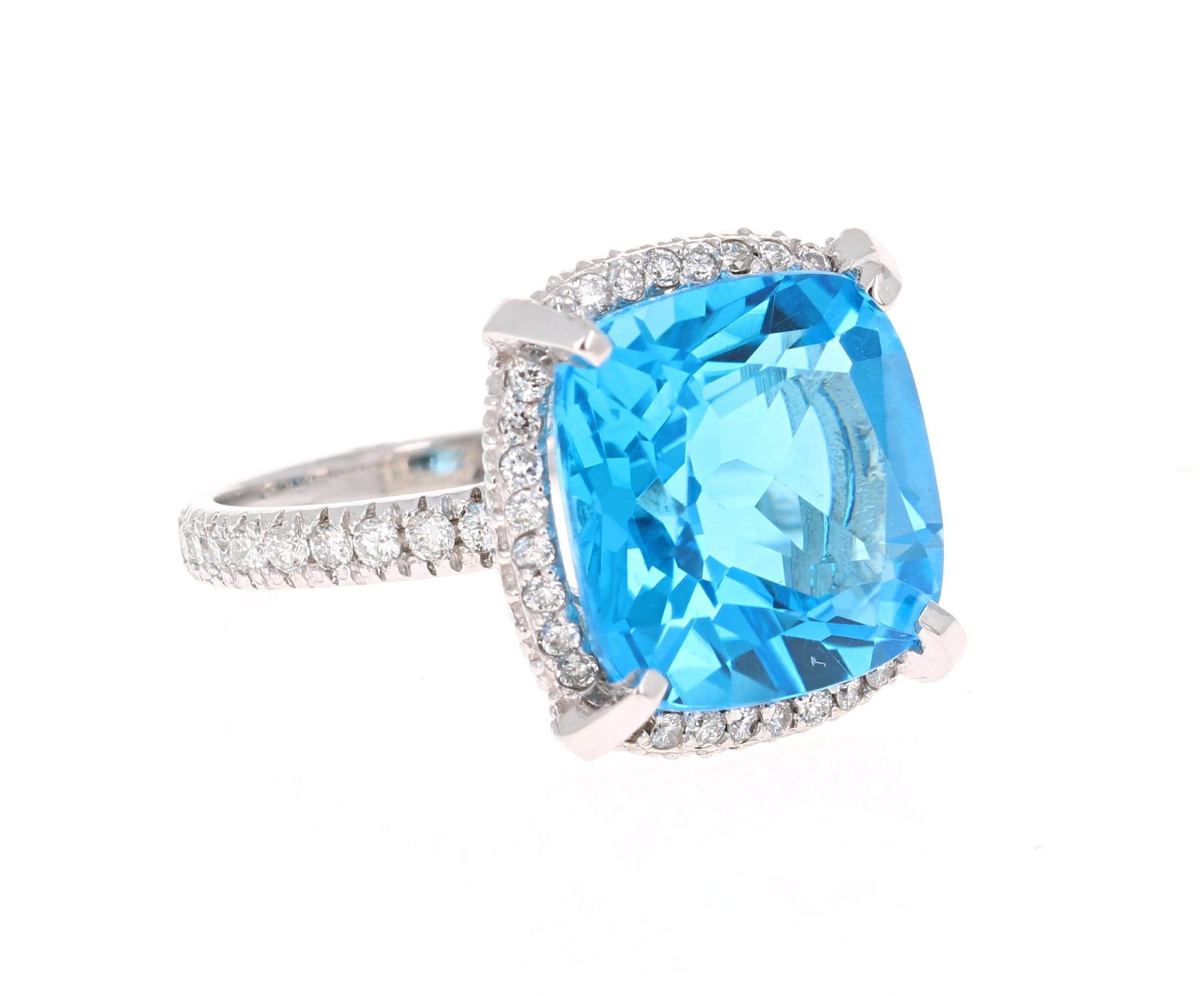 Stunning Cushion cut Blue Topaz and Diamond ring has a gorgeous large Blue Topaz that weighs 11.33 Carats. It is surrounded by 50 Round Cut Diamonds that weigh 0.59 Carats. The total carat weight of the ring is 11.92 Carats. 
The ring is crafted in