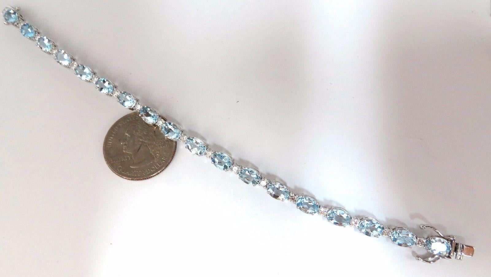 Aquamarines & Diamonds Tennis.

10.50ct. Natural Aquamarines bracelet.

Oval, full cuts 

Clean clarity

Transparent & Prime Vivid Aqua Blues.

 average: 5 X 7mm

18 count.



1.47ct Diamonds

Rounds & full cuts

Vs-2 clarity.

G-colors.

14kt.