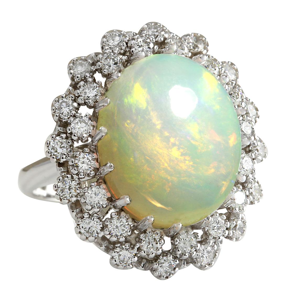 11.98 Carat Opal 14 Karat White Gold Diamond Ring
Stamped: 14K White Gold
Total Ring Weight: 12.7 Grams
Total  Opal Weight is 10.58 Carat (Measures: 17.00x13.00 mm)
Total Diamond Weight is 1.40 Carat
Color: F-G, Clarity: VS2-SI1
Face Measures: