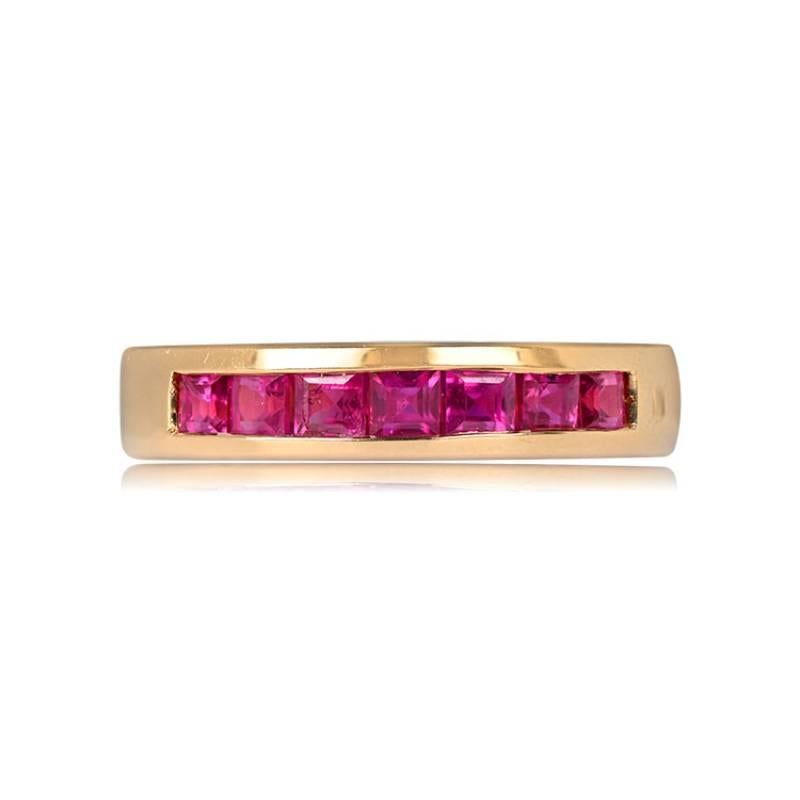 A splendid half-eternity band crafted in 14k yellow gold, adorned with calibre-cut natural rubies totaling 1.19 carats. The band boasts a width of approximately 4.25mm, creating a timeless and vibrant piece.

Ring Size: 6.5 US, Resizable
Metal: