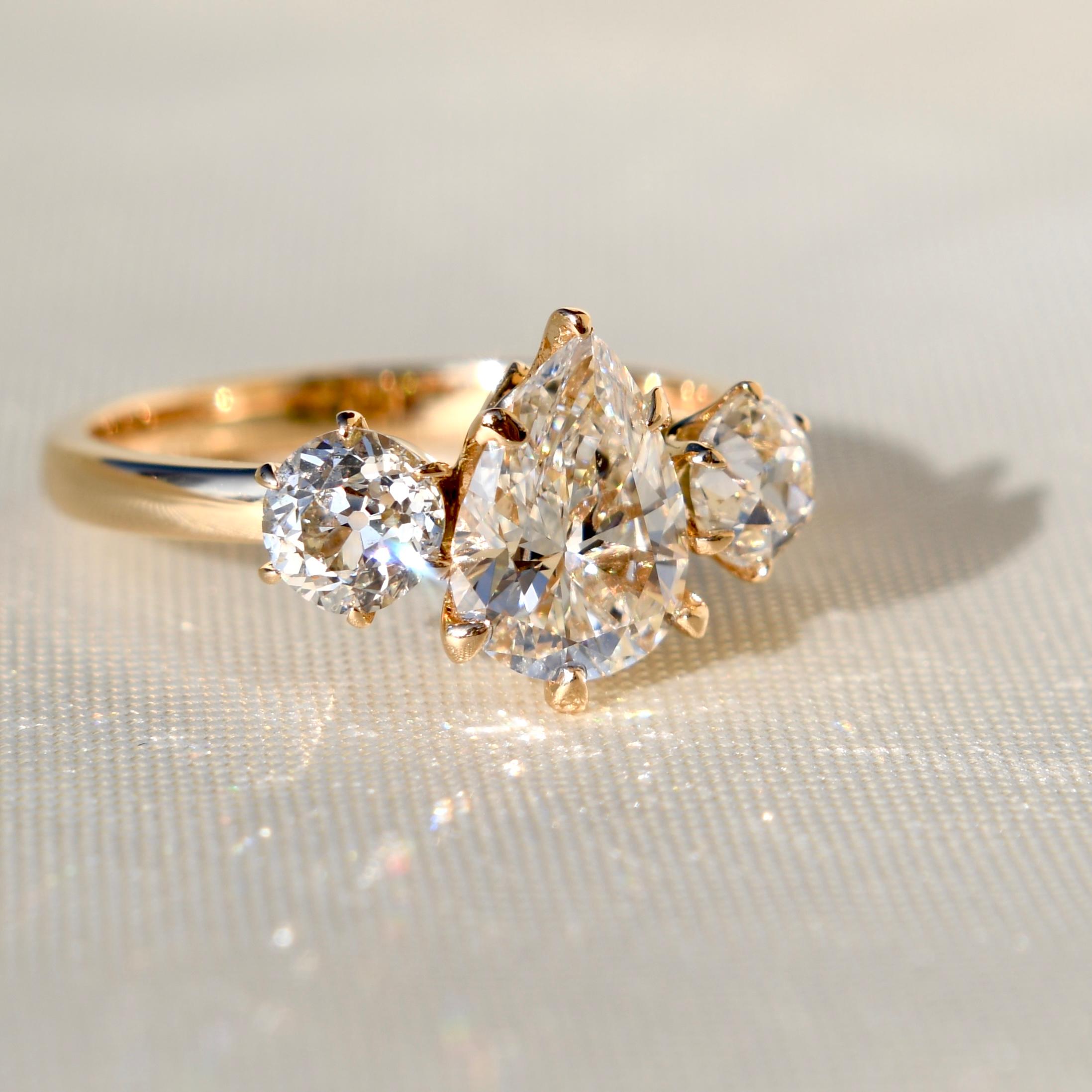 This ring was newly made by Beaubijouxantique.

The diamonds are vintage and antique.

- One pear cut diamond, 1.19 ct (H/ SI1, GIA: 6462272338)
- One old European cut diamond, 0.40 ct (I/ SI2, GIA: 2467302809)
- One old European cut diamond, 0.45