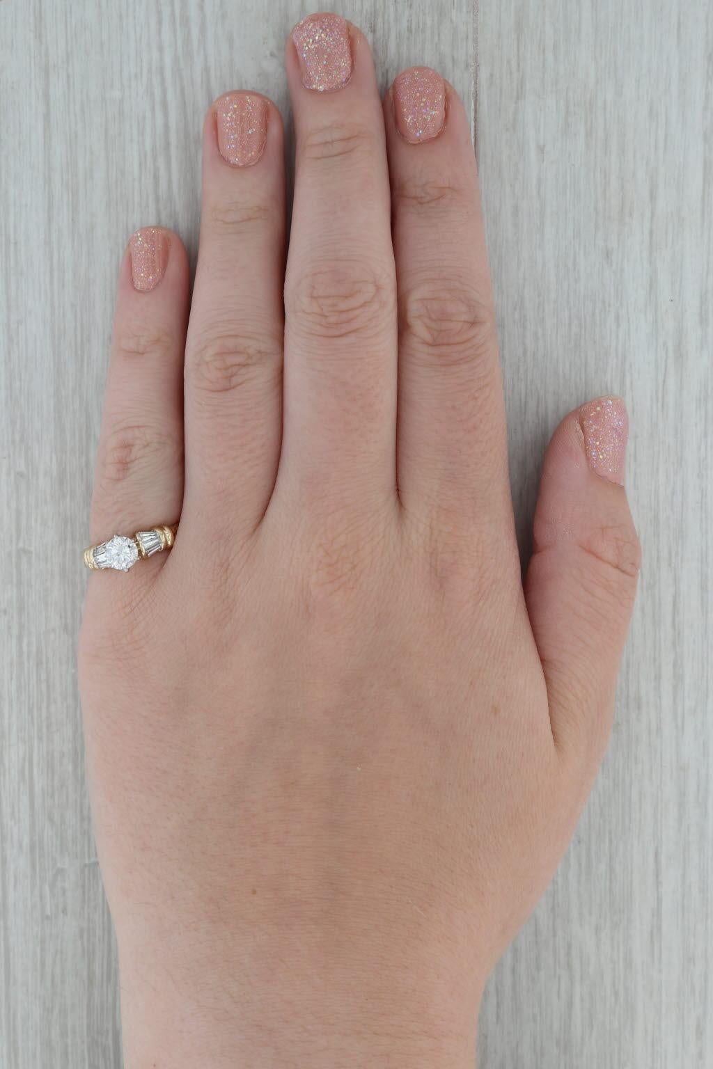 Gemstone Information:
- Natural Diamond -
Carats - 0.85ct 
Cut - Round Brilliant
Color - E - F
Clarity - I1 

- Natural Diamonds -
Total Carats - 0.34ctw 
Cut - Baguette
Color - F - G
Clarity - VS2 - SI1

Metal: 14k White & Yellow Gold
Weight: 4.7