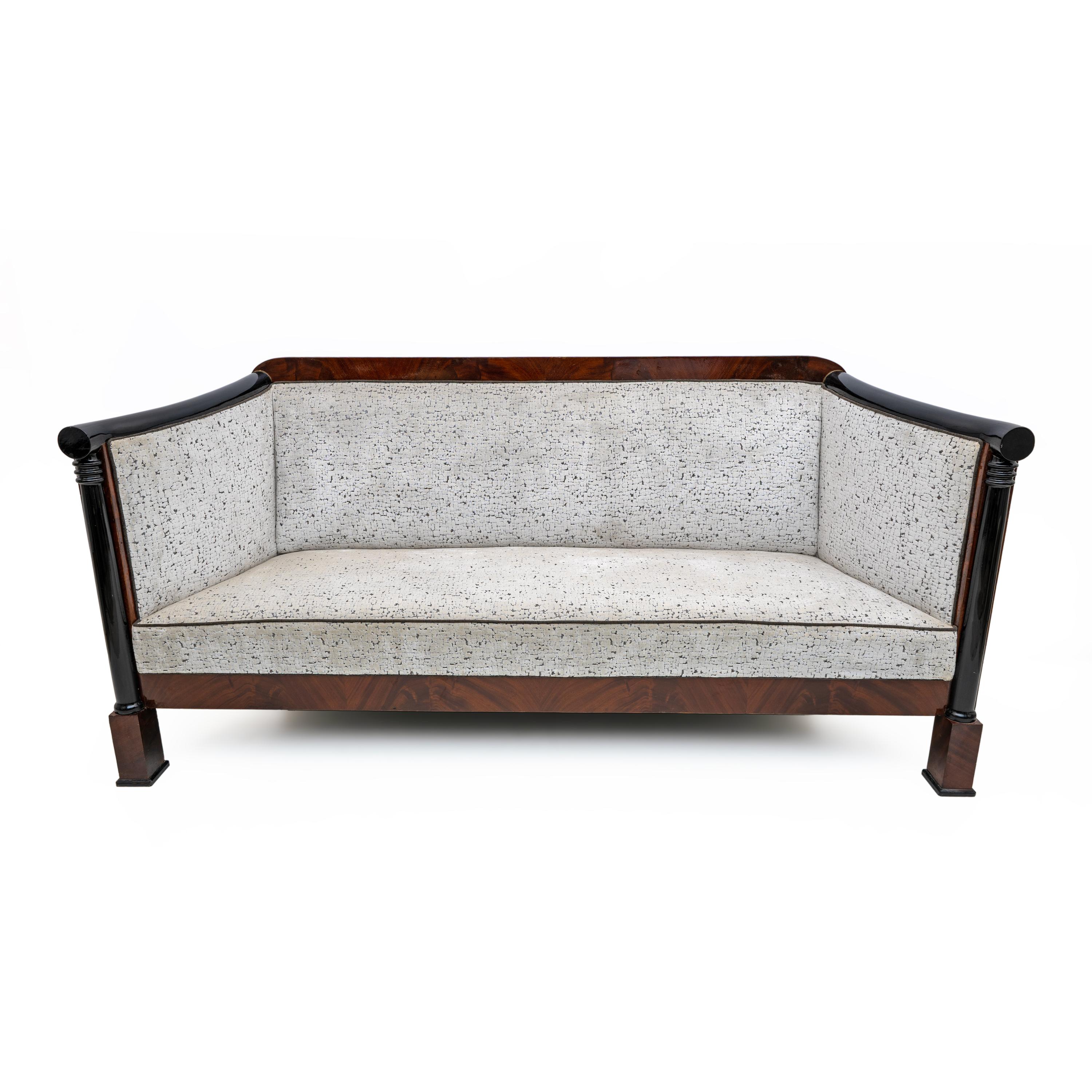 This elegant and truly exceptional Viennese Biedermeier-style sofa and two armchairs were made around 1840.

Mahogany and ebonized beech veneer, polished to maintain the original period patina, are upholstered in textured ivory white velvet. The