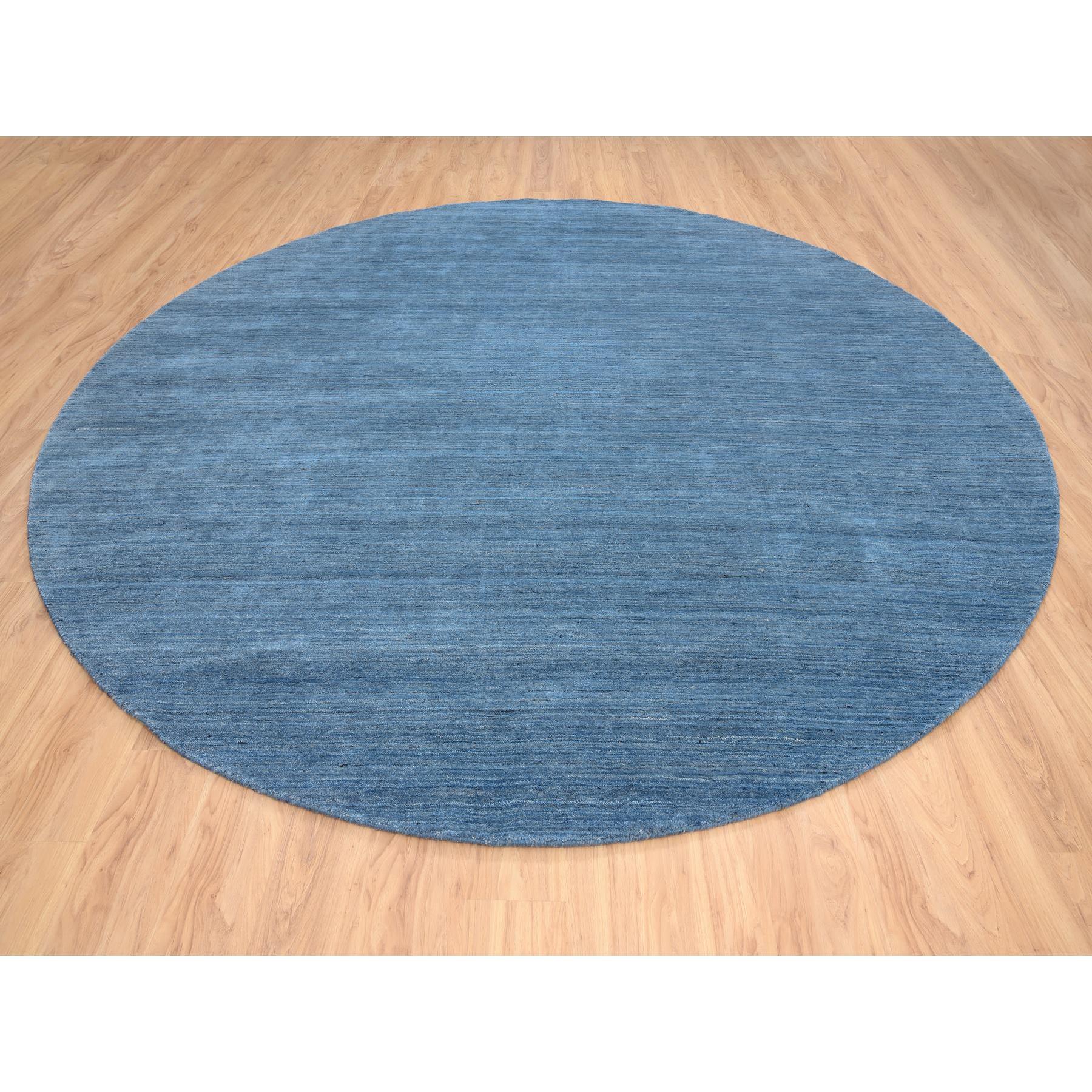 This is a truly genuine one-of-a-kind Denim Blue, Tone on Tone, Pure Wool Hand Loomed, Modern Design, Round Oriental Rug. It has been Loomed for months and months in the centuries-old weaving craftsmanship techniques by expert artisans.
Primary