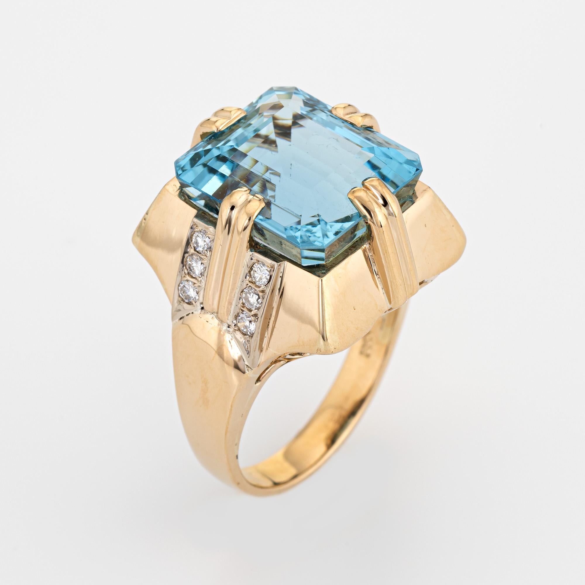 Stylish vintage estimated 11 carat aquamarine & diamond cocktail ring (circa 1960s) crafted in 14 karat yellow gold. 

Emerald cut aquamarine measures 13.5mm x 12mm (estimated at 11 carats). The aquamarine is in very good condition and free of