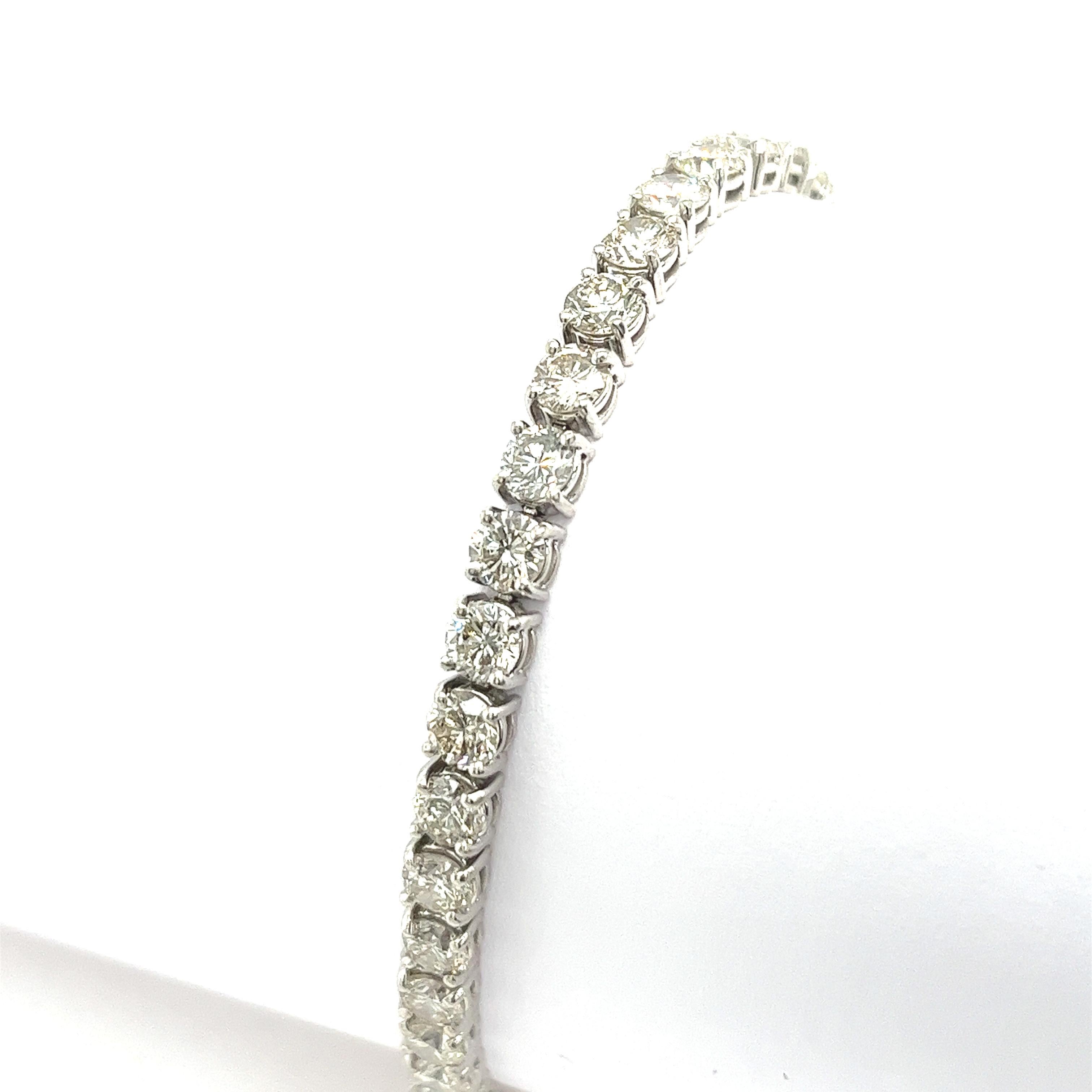 An elegant tennis bracelet that is sure to be a favorite. 
This delicate bracelet is set with a total of 12.0ct diamonds 
that are prong-set across the length of the bracelet in platinum. 
This is a timeless piece that is sure to be a