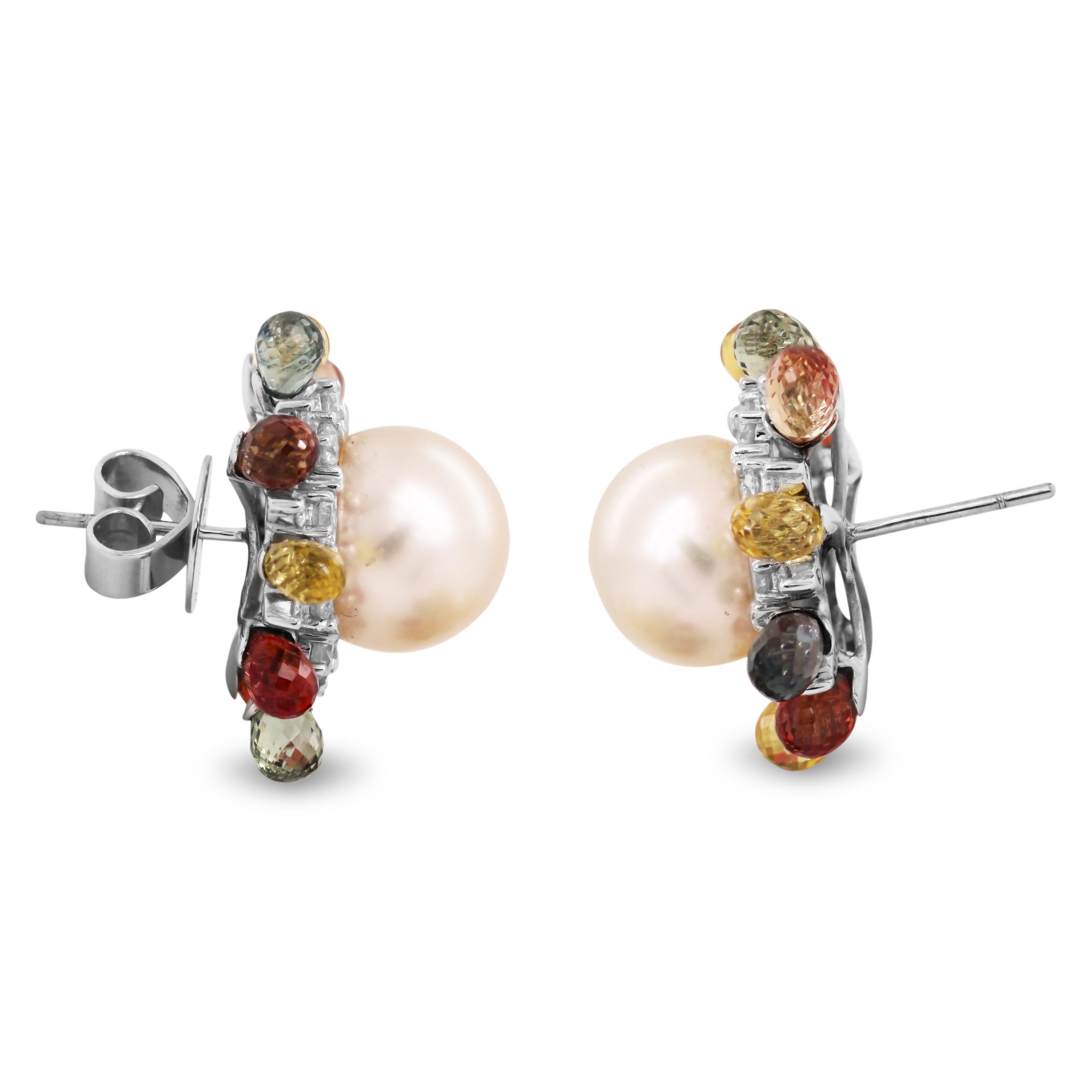 11mm Round Pearl Briolette Sapphires 18K White Gold Stud Earrings

Two Pearls, 11.4mm each on the center of each earring.

1.60ct. total weight Diamonds surround pearl 

4.00ct. apprx. Multi-Color Briolette Sapphires

1 inch width. Stud earrings