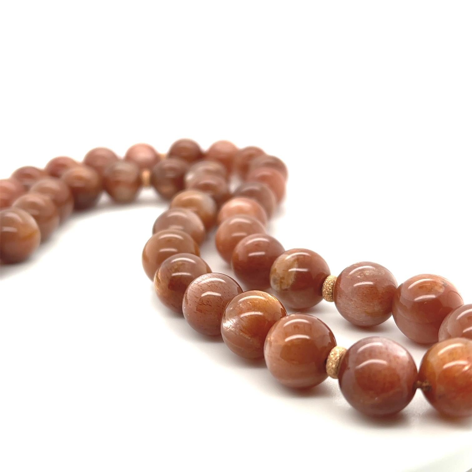 This luscious strand of radiant, bronze-colored beads looks like it was kissed by the sun! Fine quality, beautifully matched sunstone beads with their shimmering, frosted glow will complement both warm and cool tones, and their mahogany hues are