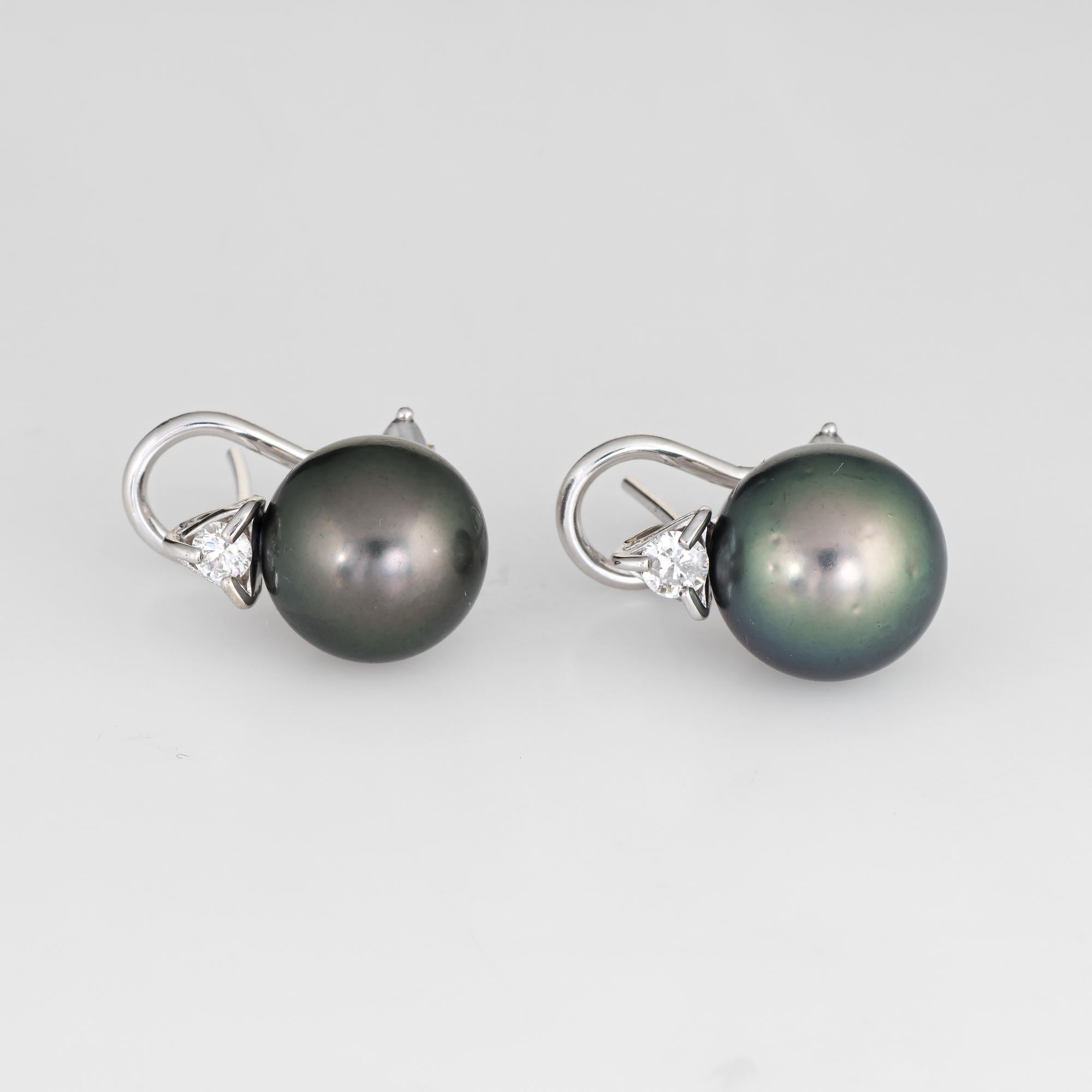 Stylish pair of Tahitian South Sea cultured black pearl & diamond earrings crafted in 14k white gold. 

Cultured Tahitian black pearls measure 11mm (each). The diamonds are estimated at 0.10 carats each. The total diamond weight is estimated at 0.20