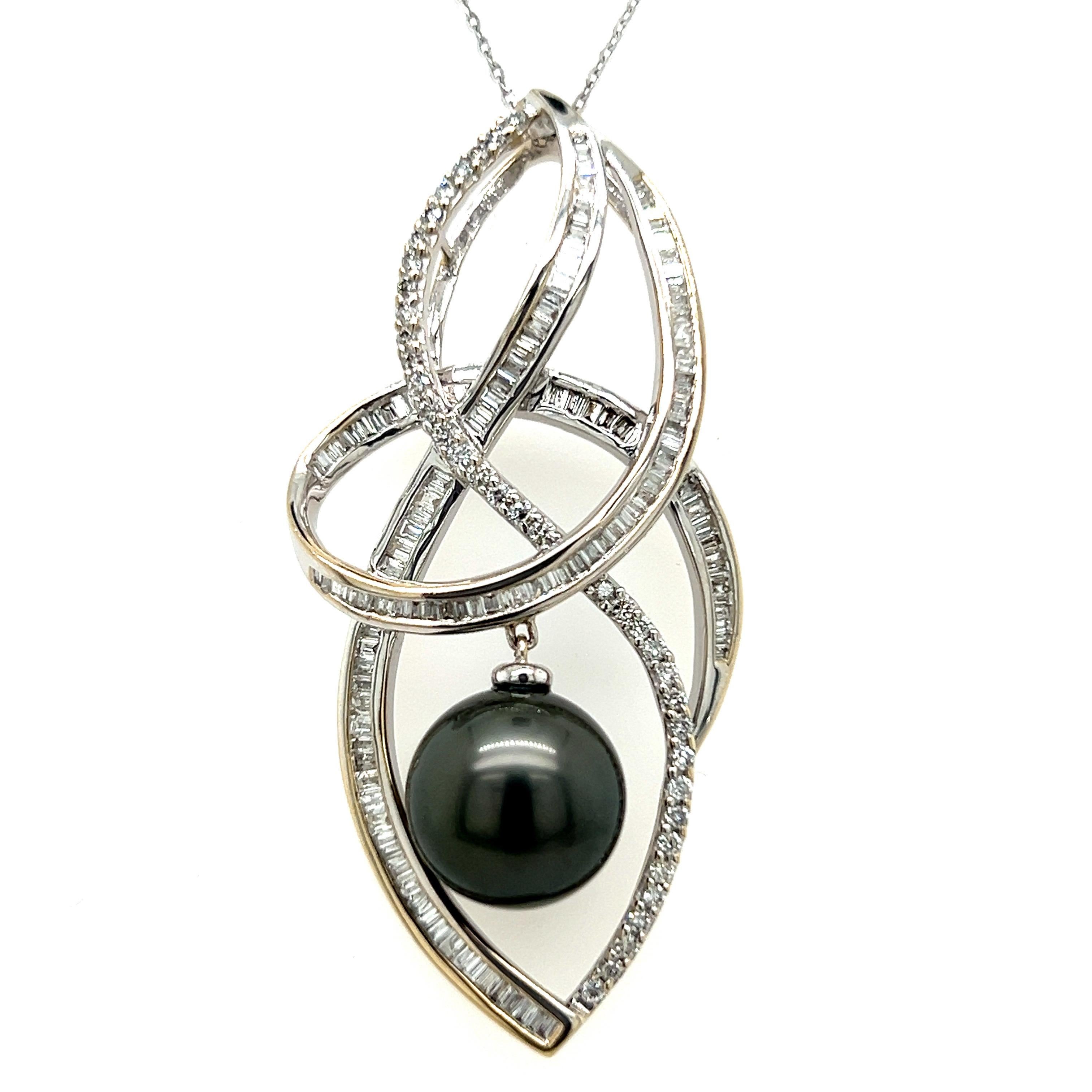 Elegant Tahitian pearl pendant. High pearly luster, slight Peacock overtone, natural 11mm Tahitian pearl dangling, accented with tapered baguette cut natural diamond and round brilliant cut diamonds. Handcrafted design set in 18 karats white gold,