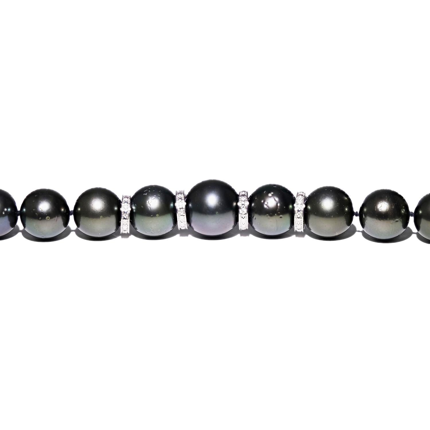 One graduated, single strand Cultured Tahitian Pearl necklace. The strand has each pearl individually hand knotted and measures 17.5 inches in length. The necklace is finished with four 2mm wide 14K white gold spacers set with genuine round diamonds