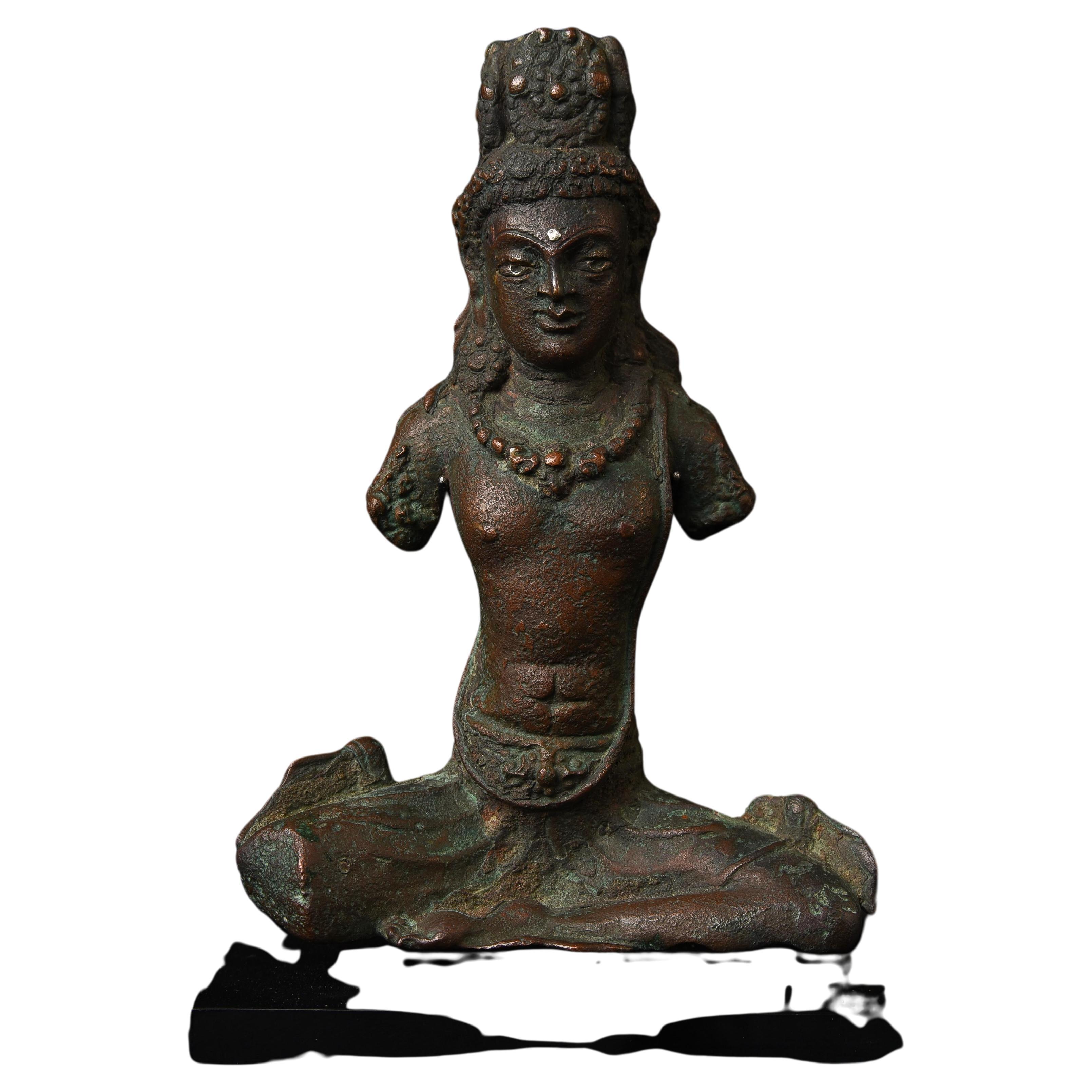 11th century West Tibetan bronze bodhisattva with Silver Inlays-  I present to you a remarkable sculpture from Western Tibet that brings much more of a Western influence to it than the vast majority of Buddhist sculptures. you can almost feel the