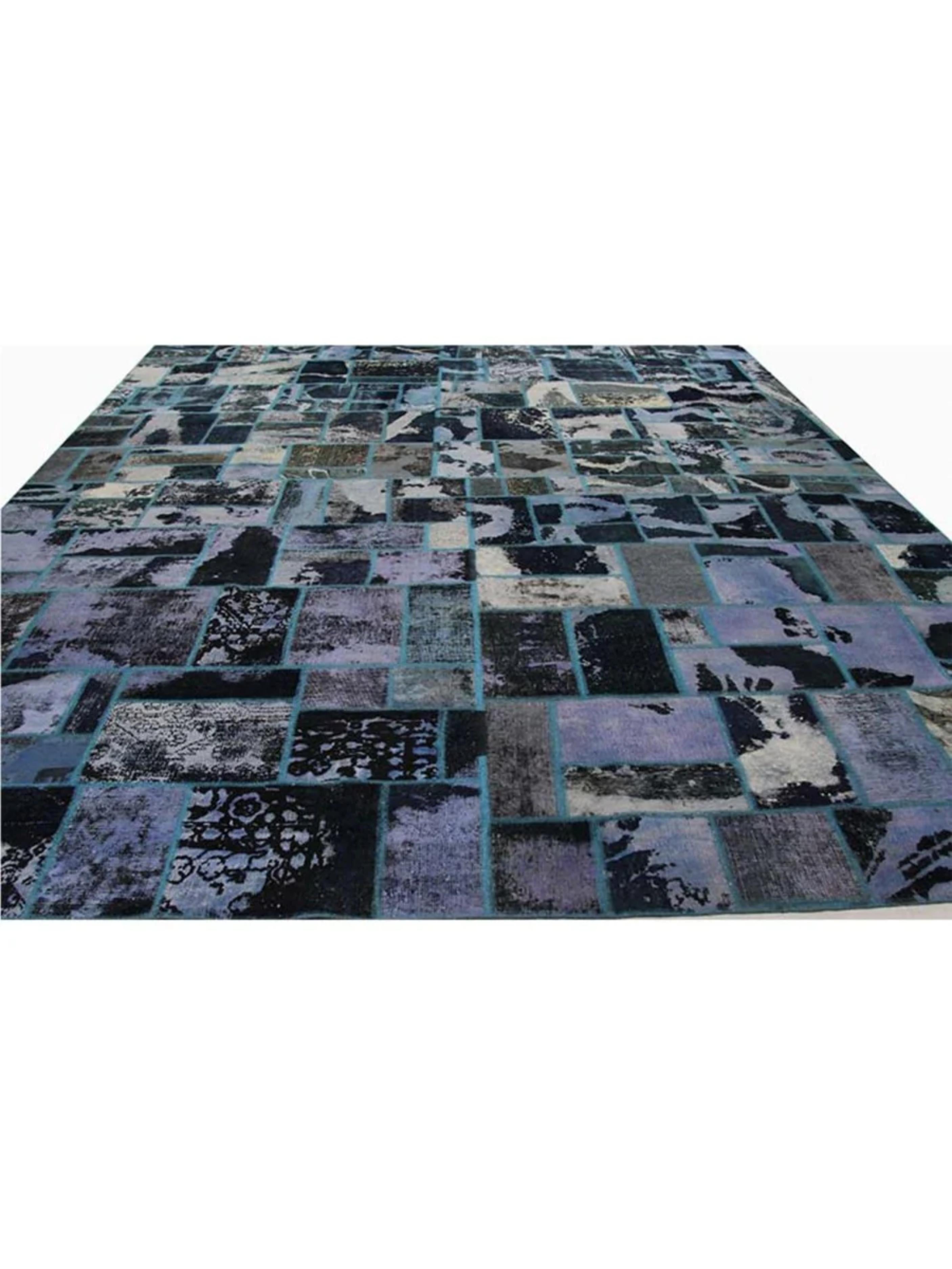 Introduce a touch of eclectic elegance to your space with the 11x15 Vintage Distressed Patchwork Area Rug, a stunning piece that effortlessly combines artistry, history, and style. Each carefully selected patch in this hand-knotted wool rug tells