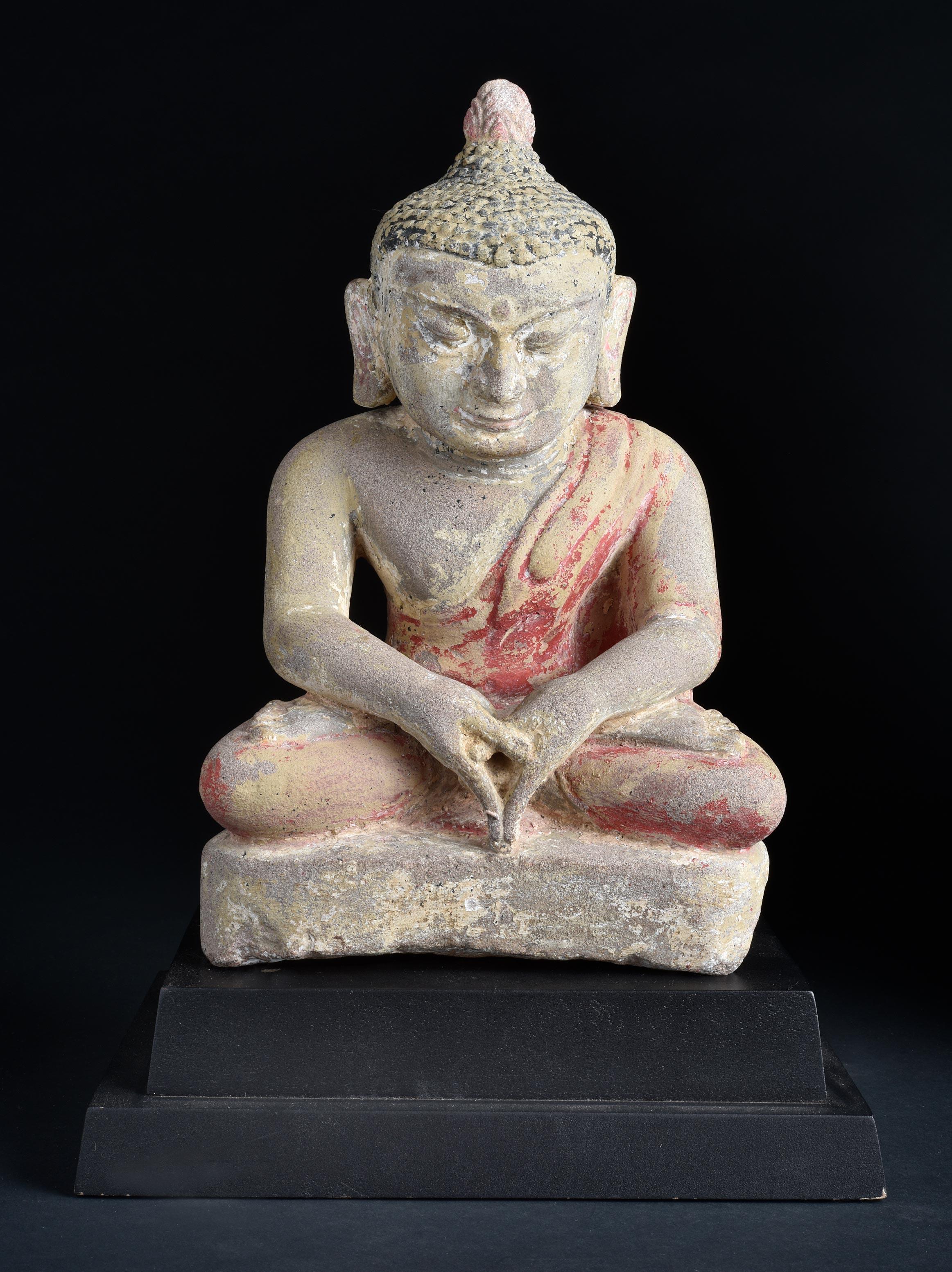 Finest 12/13thC Burmese Pagan Stone Buddha in deep concentration. Covering the body are remains of red, black, and white polychrome. The vast majority of Burmese stone pieces are modern emulations. This is the real thing. Powerful presence that