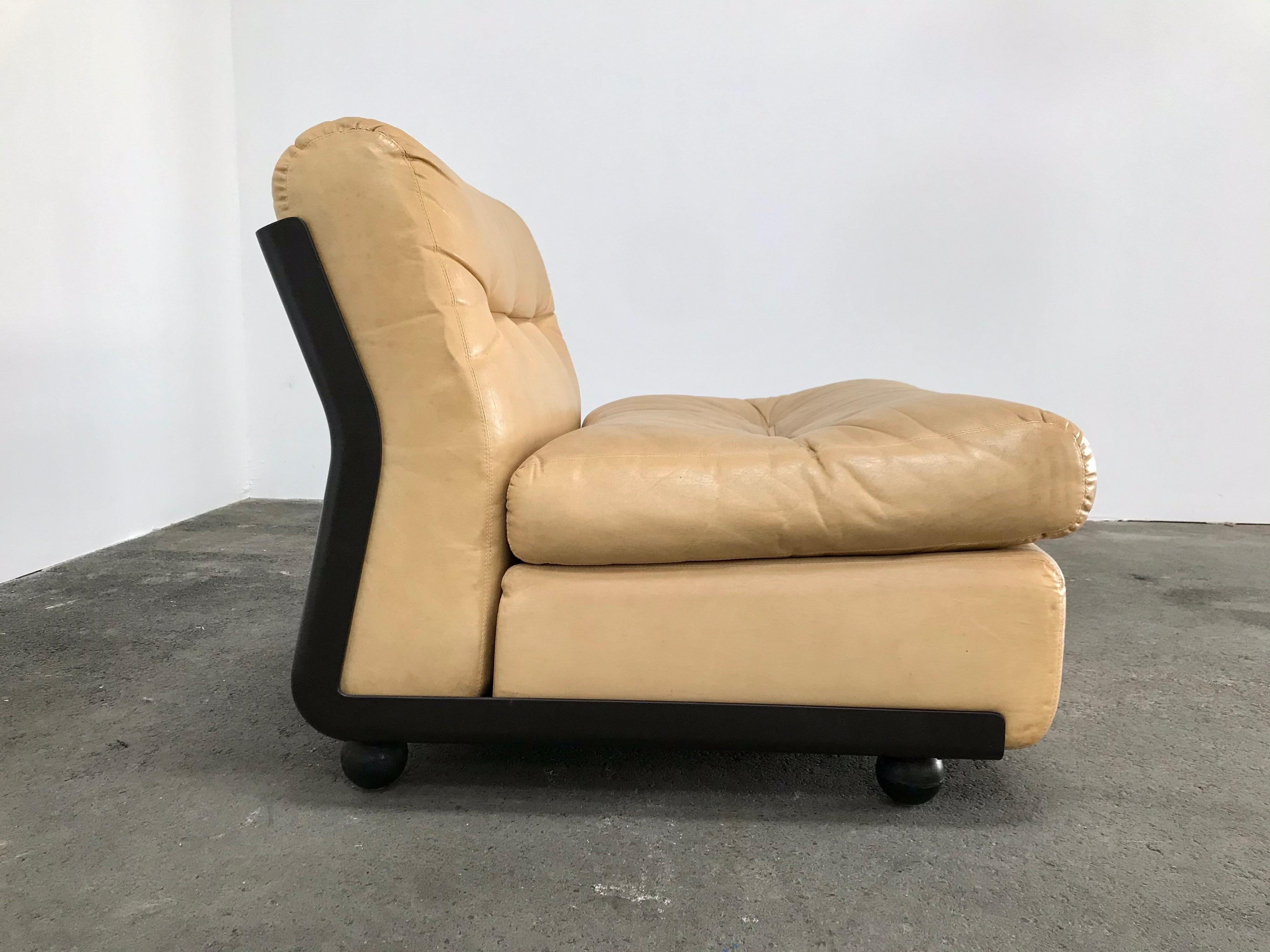 12 iconic Amanta lounges by Mario Bellini for B&B Italia. Brown fiberglass shell houses seating with fill in good condition. Reupholster to suit your large project. An additional 6 are available from the same vintage in a particular fabric, as