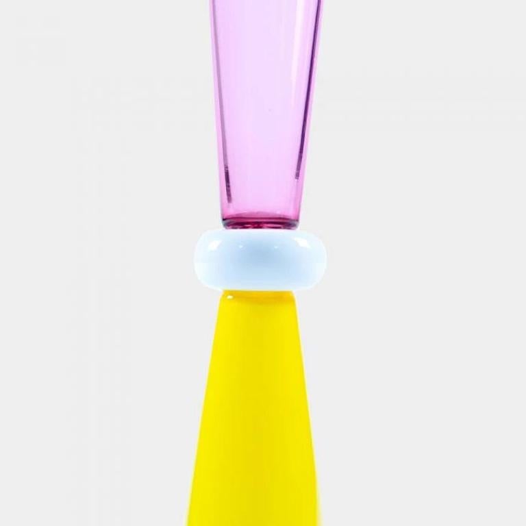 The Amaltea Vase was designed by Ettore Sottsass in 1986. The vase is part of the “Amaltea Glass” collection. Made in Murano. Signed “E.Sottsass per Memphis”. Signed on the base.

Ettore Sottsass was born in Innsbruck in 1917. In 1939 he graduated