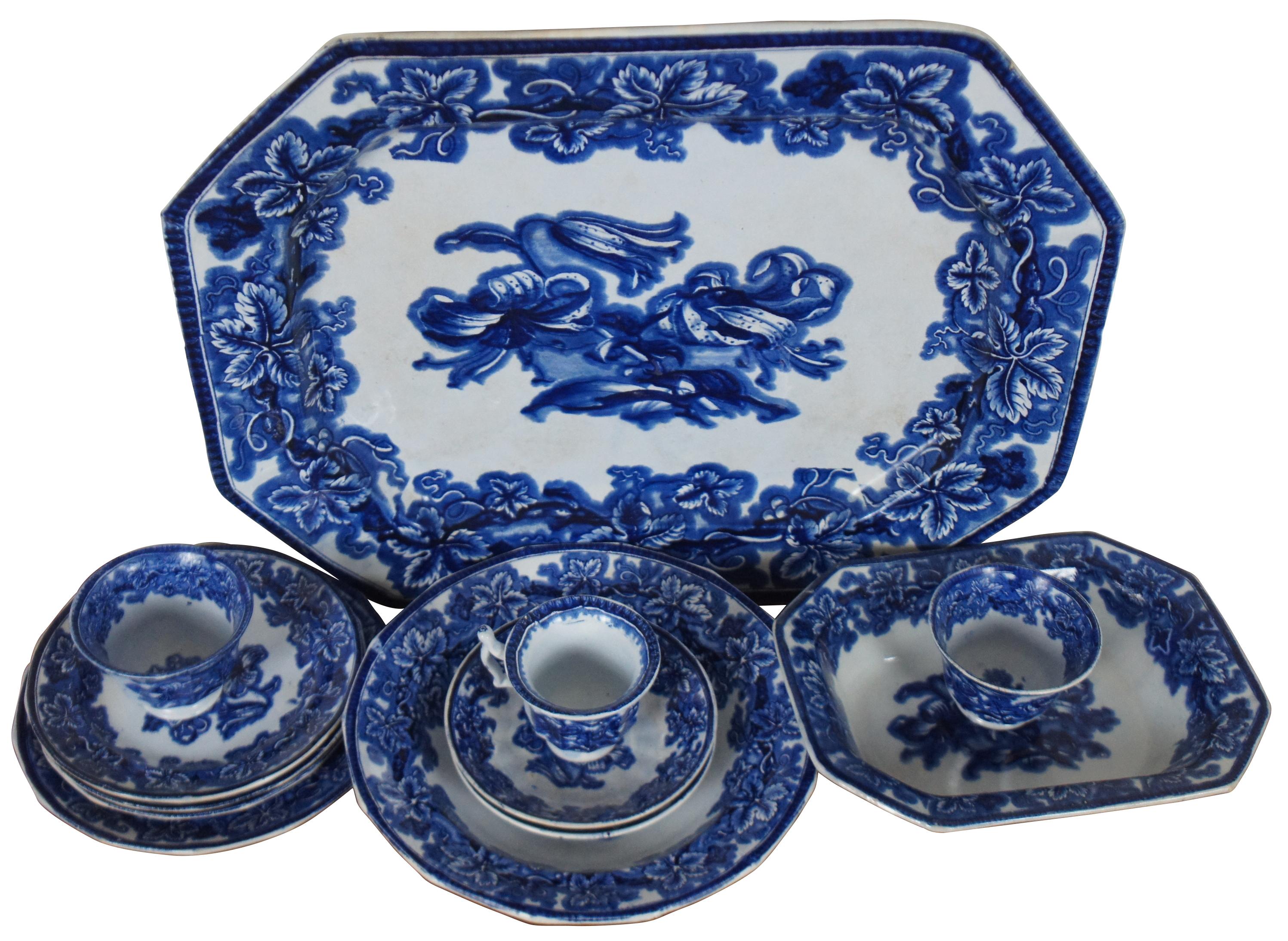 Twelve pieces of antique flow blue porcelain circa 1845 by George Phillips of Longport, Staffordshire, England in the Lobelia pattern. Lot includes a rectangular platter, a rectangular vegetable dish, one soup plate/bowl, one salad plate, three