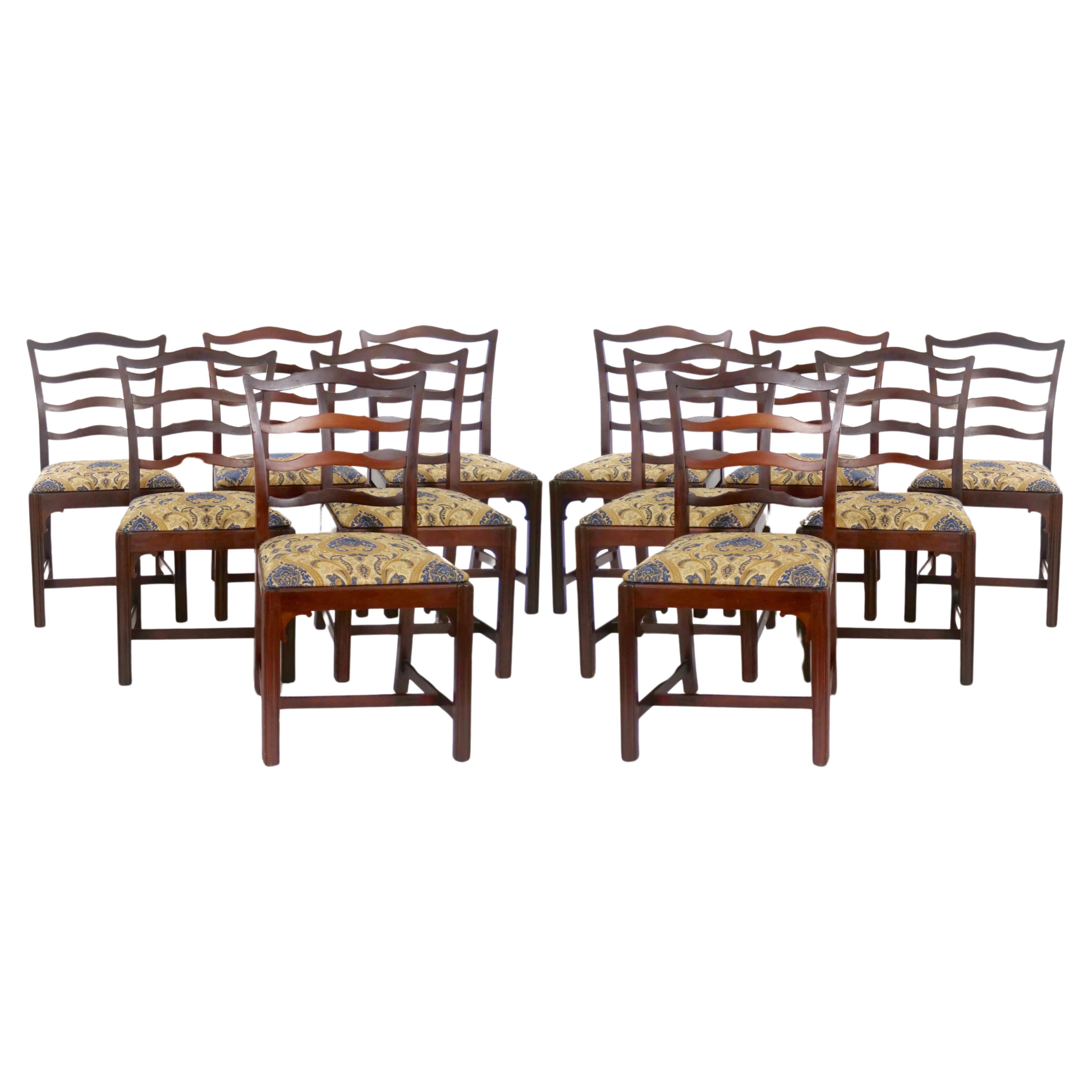 Introduce timeless elegance to your dining space with our exquisite set of 12 Antique Chippendale Style Ribbon Back Dining Chairs, crafted circa 1928. Each chair is a testament to the enduring allure of Chippendale design, featuring mahogany frames