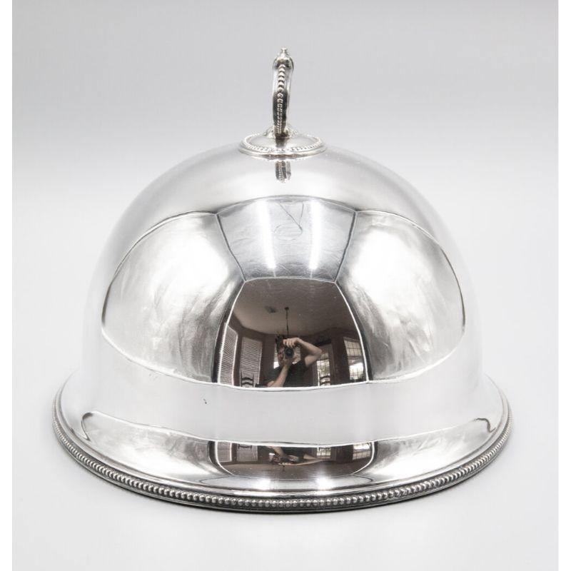 A superb antique silverplate meat platter dome from England, circa 1900. No maker's mark. This fine silver meat dome has an ornate handle and lovely beaded edge. It would be beautiful for display or serving, and these are also fabulous hung in