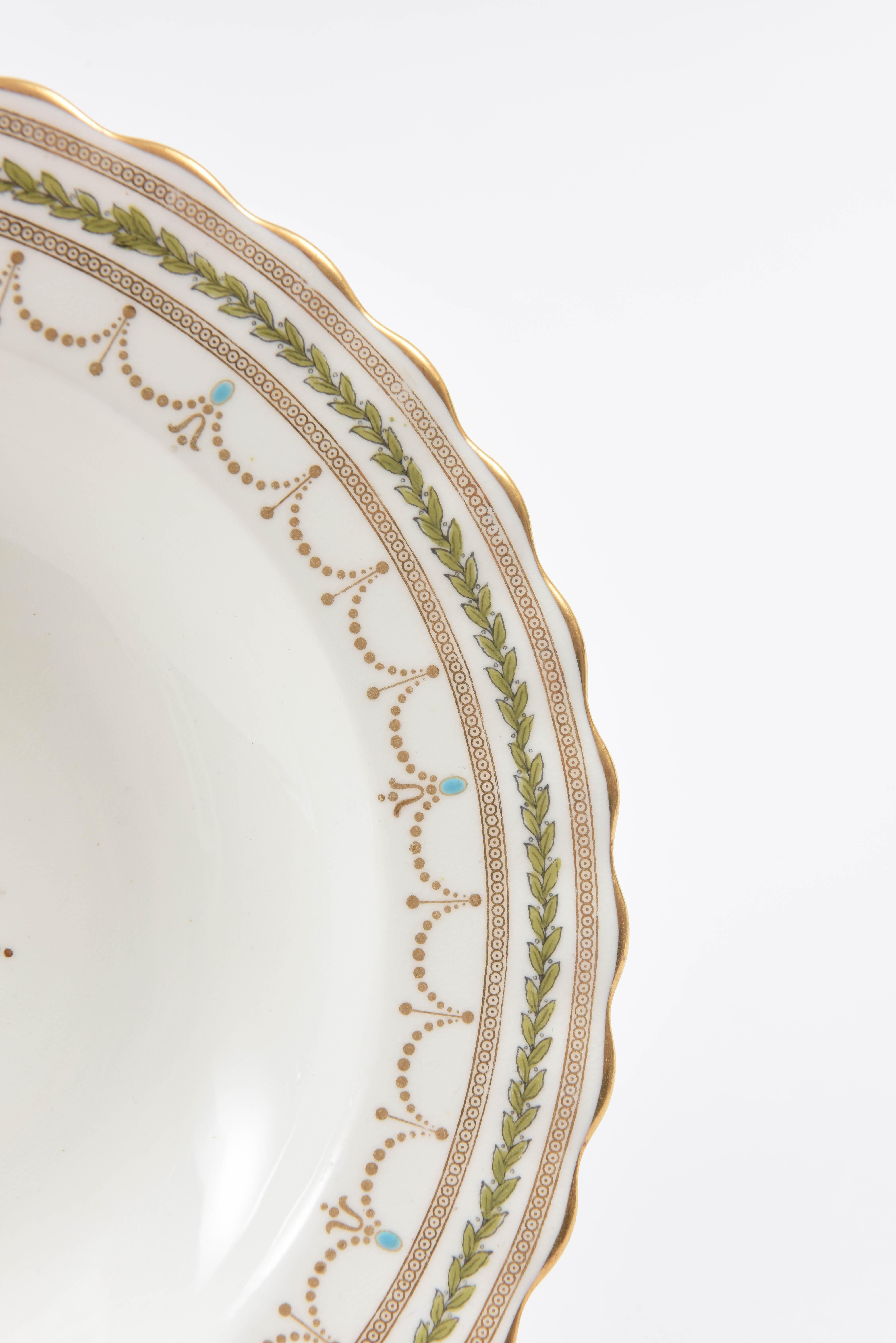 A classic pattern from Royal Doulton featuring a slightly scalloped shape, gilt swag accents, acanthus leaves and a striking gilt center medallion. The perfect size also for risotto, pasta, and desserts with sauces. We love the touch of green and