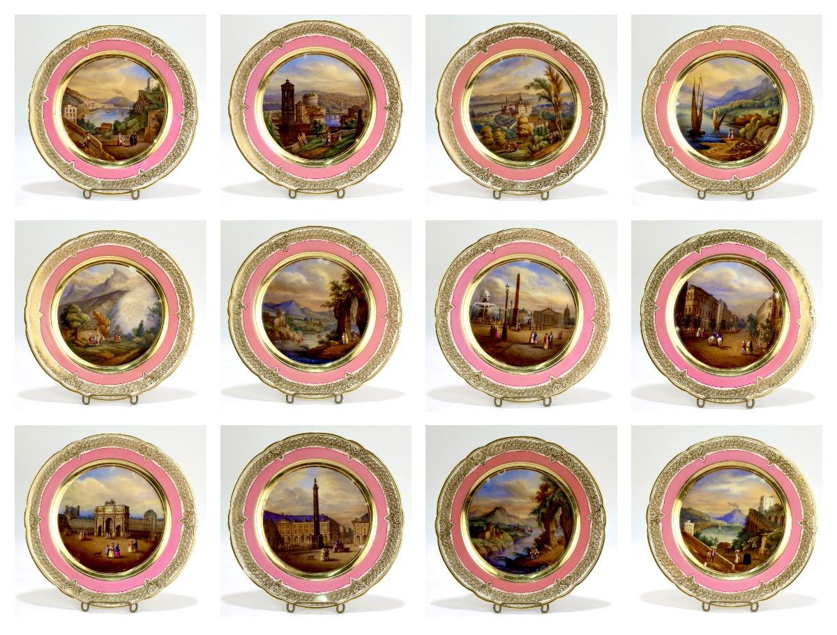 A wonderful set of Darte type Paris Porcelain plates. 

Each parcel-gilt and hand painted plate has scenes of mid-19th century, Europe.

Each with a French inscription to the reverse that identifies the location. The locations include scenes from