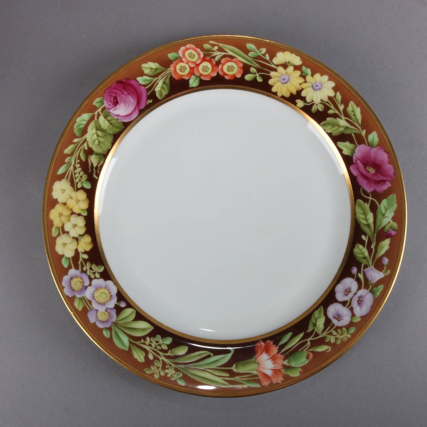 Set of eight German hand-painted Tirschenreuth fine china sandwich pates feature floral rim with gilt highlights, en en verso Bavaria Tirschenreuth mark, circa 1900.

Measures: 1