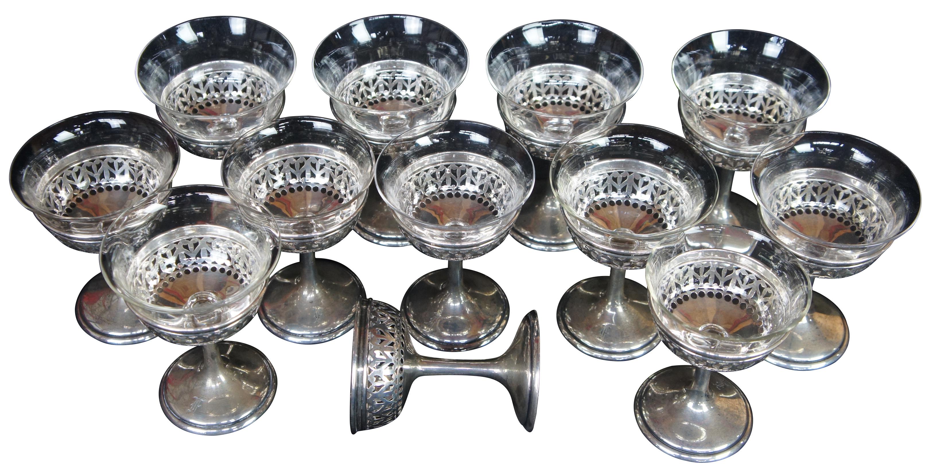Set of 12 antique Gorham styerling silver 925 champagne or dessert glasses with pierced edge and hand blown glass inserts. Marked with lion anchor and G, Sterling A8767 on base.
