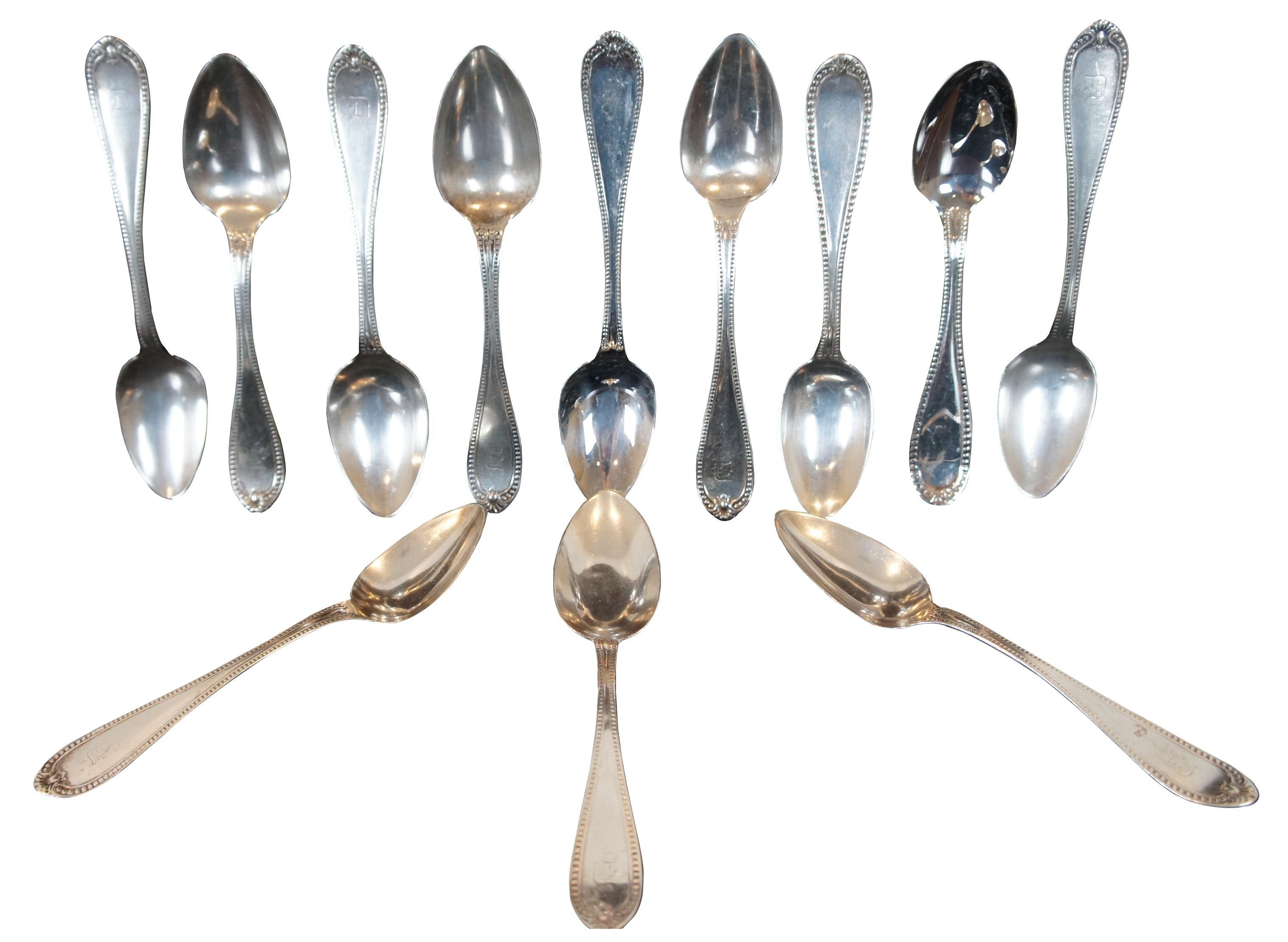 Set of twelve antique sterling silver teaspoons by JE Caldwell and JD Chase with matching beaded edge pattern and monogrammed with a D.
284.9 g.
