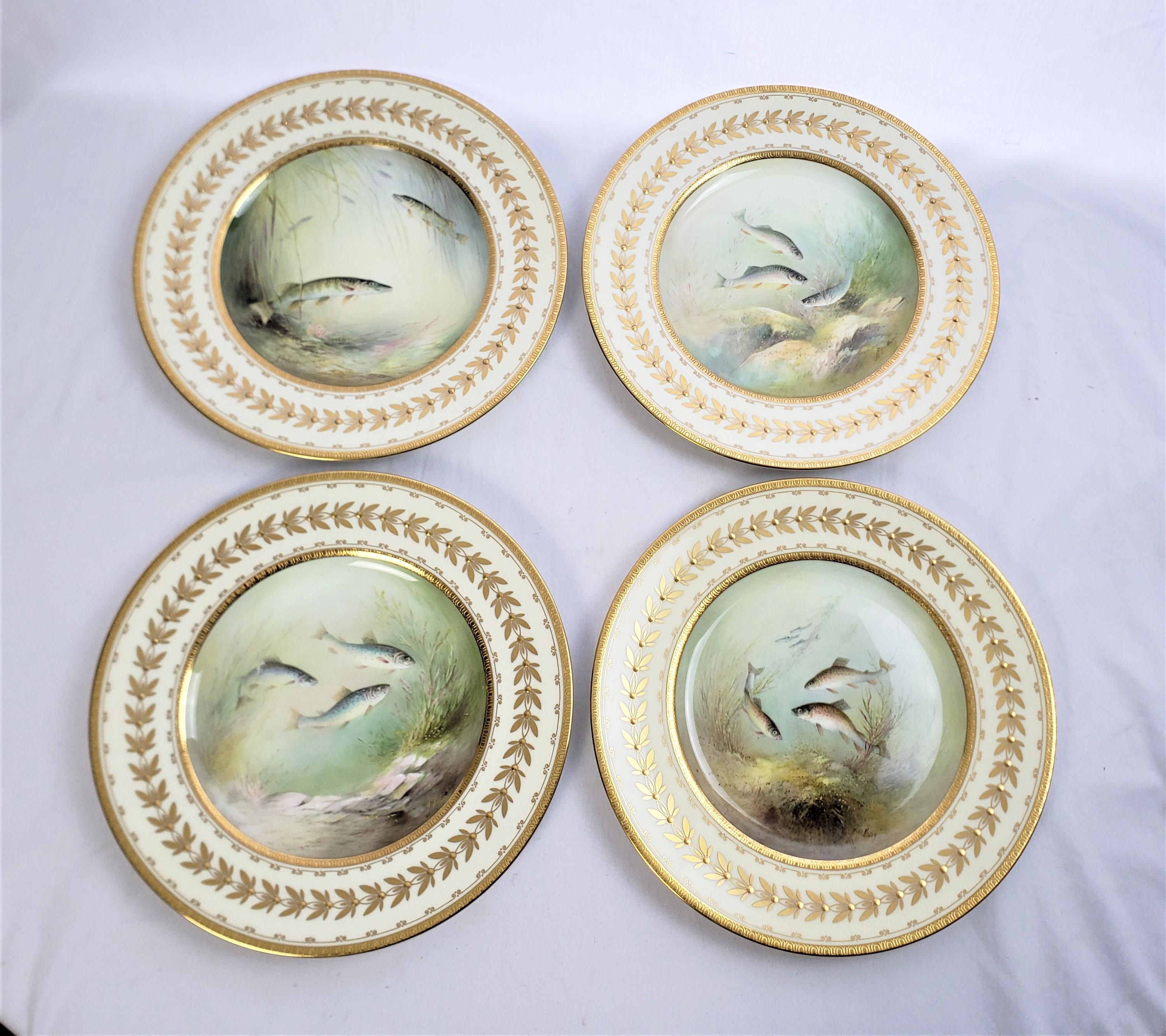 This set of cabinet plates were made by the renowned Minton factory of England in approximately 1900 for the Birks exclusive department store chain and done in a Victorian style. The plates are composed of bone china in a white ground with