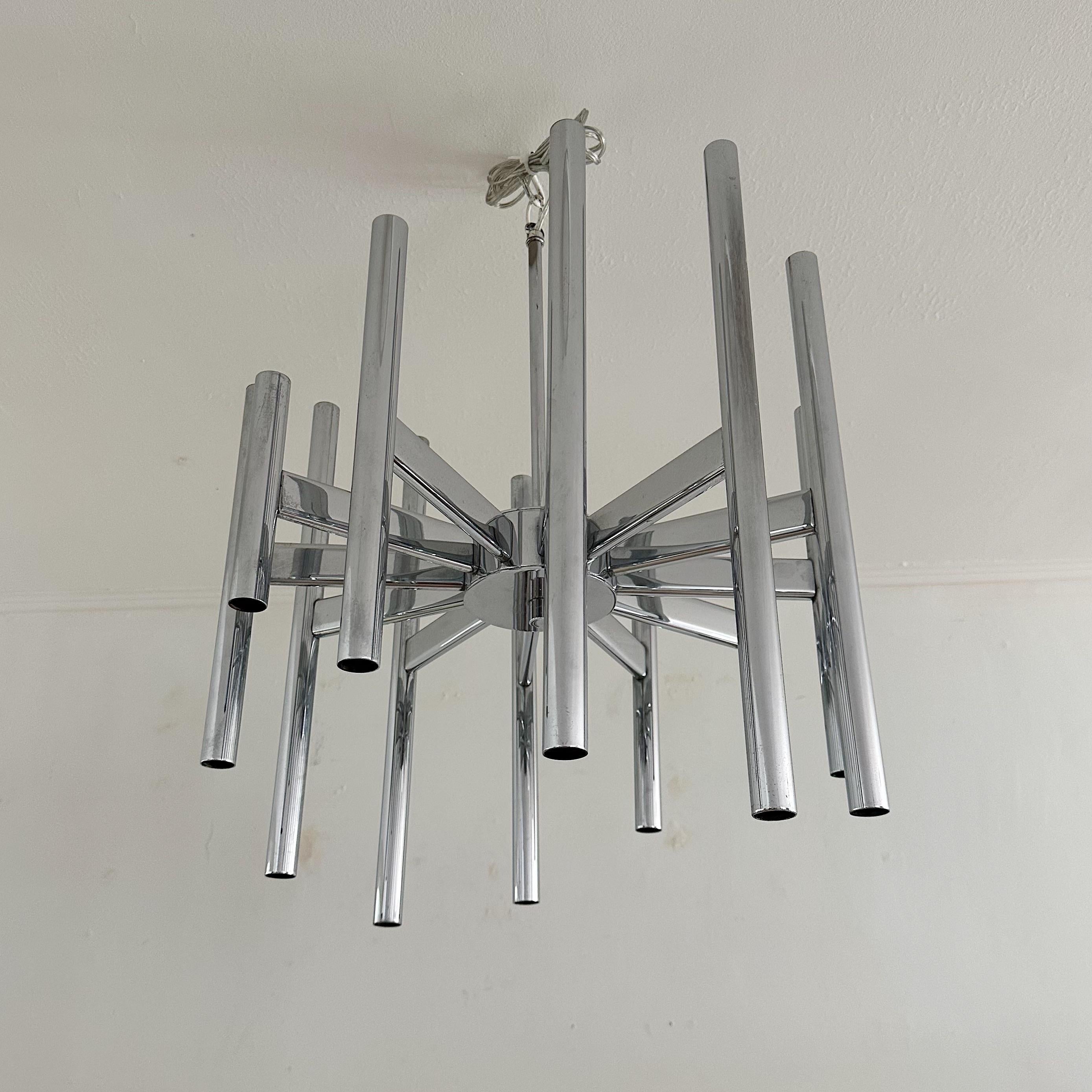Mid Century 12 Arm, 24 light Chrome  Chandelier by Gaetano Sciolari.  A unique 12-arm design, with each arm supporting two lights—one on the upper portion and the other on the lower.  In total, you get 24 light points.