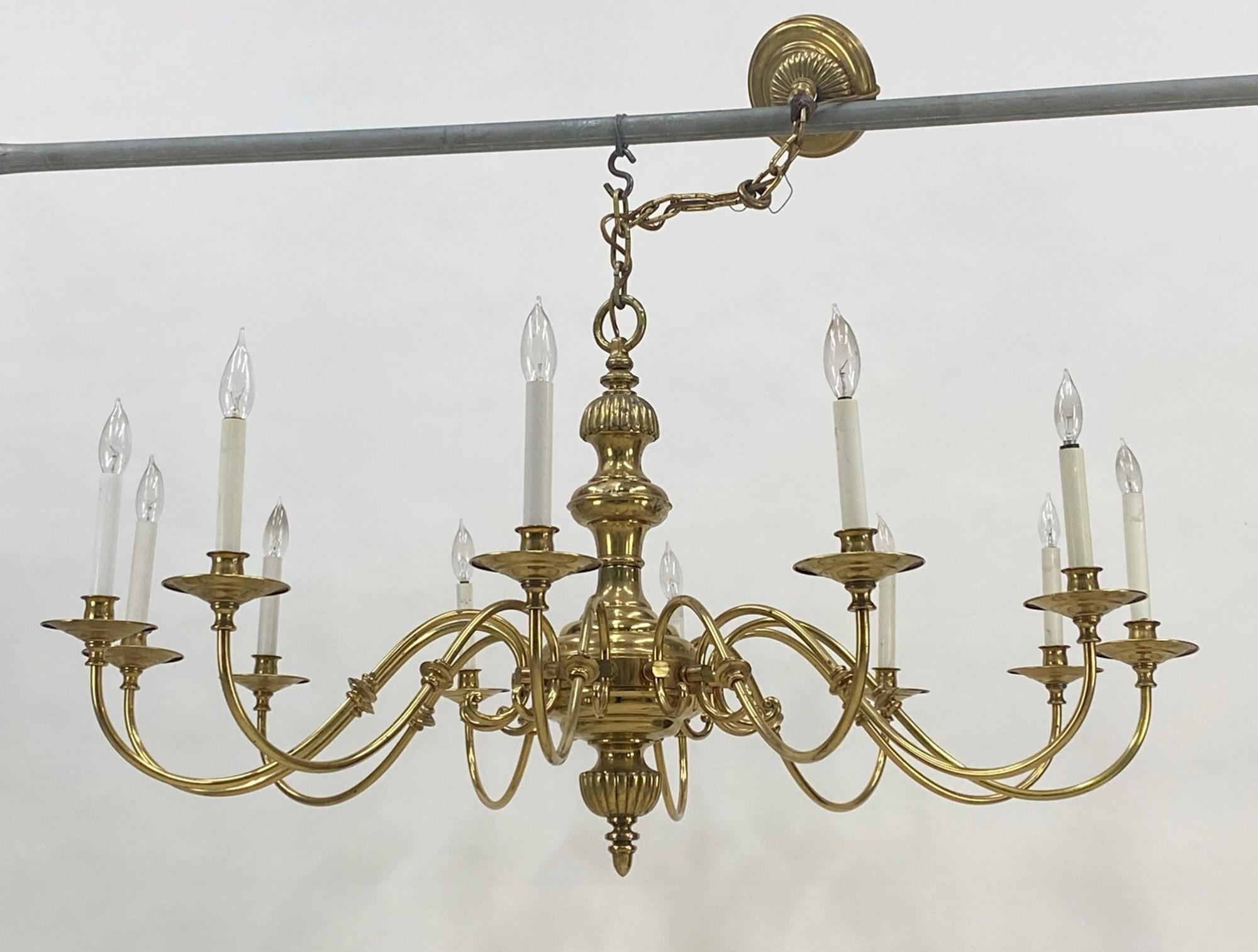 20th century brass 12 arm Williamsburg ballroom chandelier. Cleaned and rewired. Small quantity available at time of posting. Priced each. Please inquire. Please note, this item is located in our Scranton, PA location.