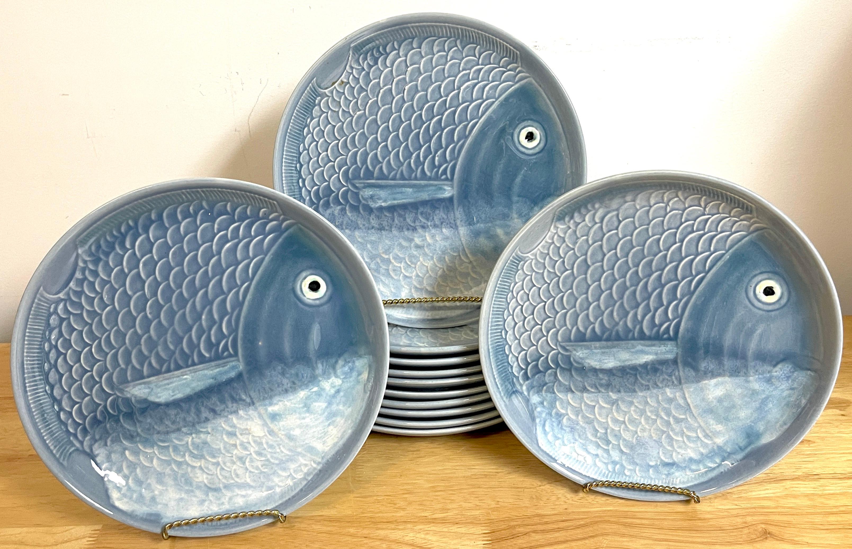 12 blue & white faience fish motif plates, each one realistically painted and modeled, made in Portugal, circa 1970s.