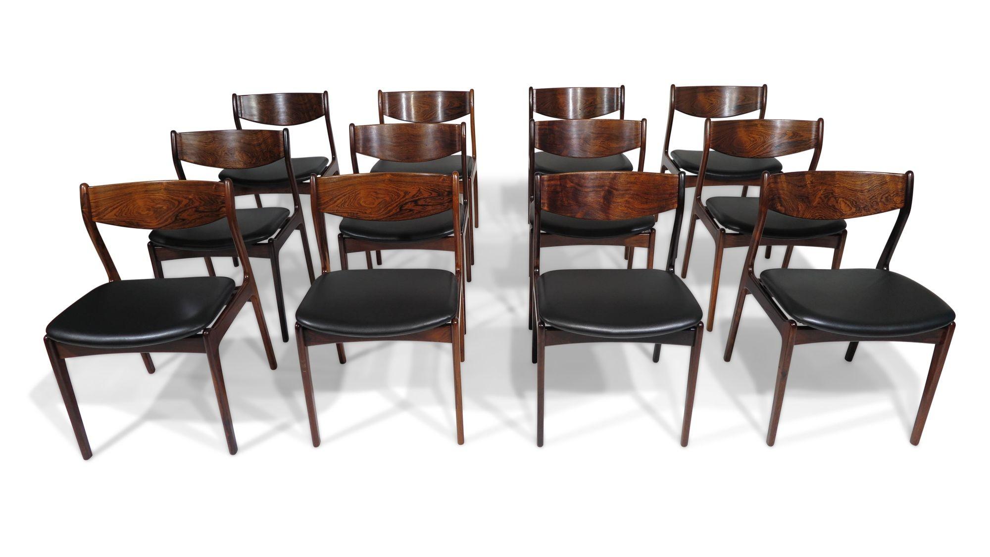 Set of twelve Danish dining chairs designed by P.E. Jorgensen for Farso Stolefarik, 1955, Denmark. The chairs are crafted of exotic Brazilian rosewood with dark figured grains, comfortable backrest, newly upholstered in a soft black leather. Our