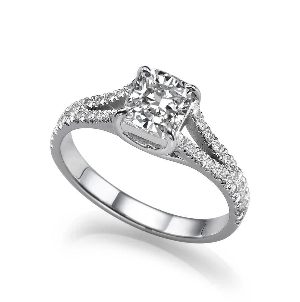 Dazzling solitaire with accents split shank style diamond engagement ring. Center stone is of 1 carat, natural, princess shape, F-G color, VS2-SI1 clarity diamond and it is surrounded with 26 natural diamonds. Diamond is clarity enhanced.
 
