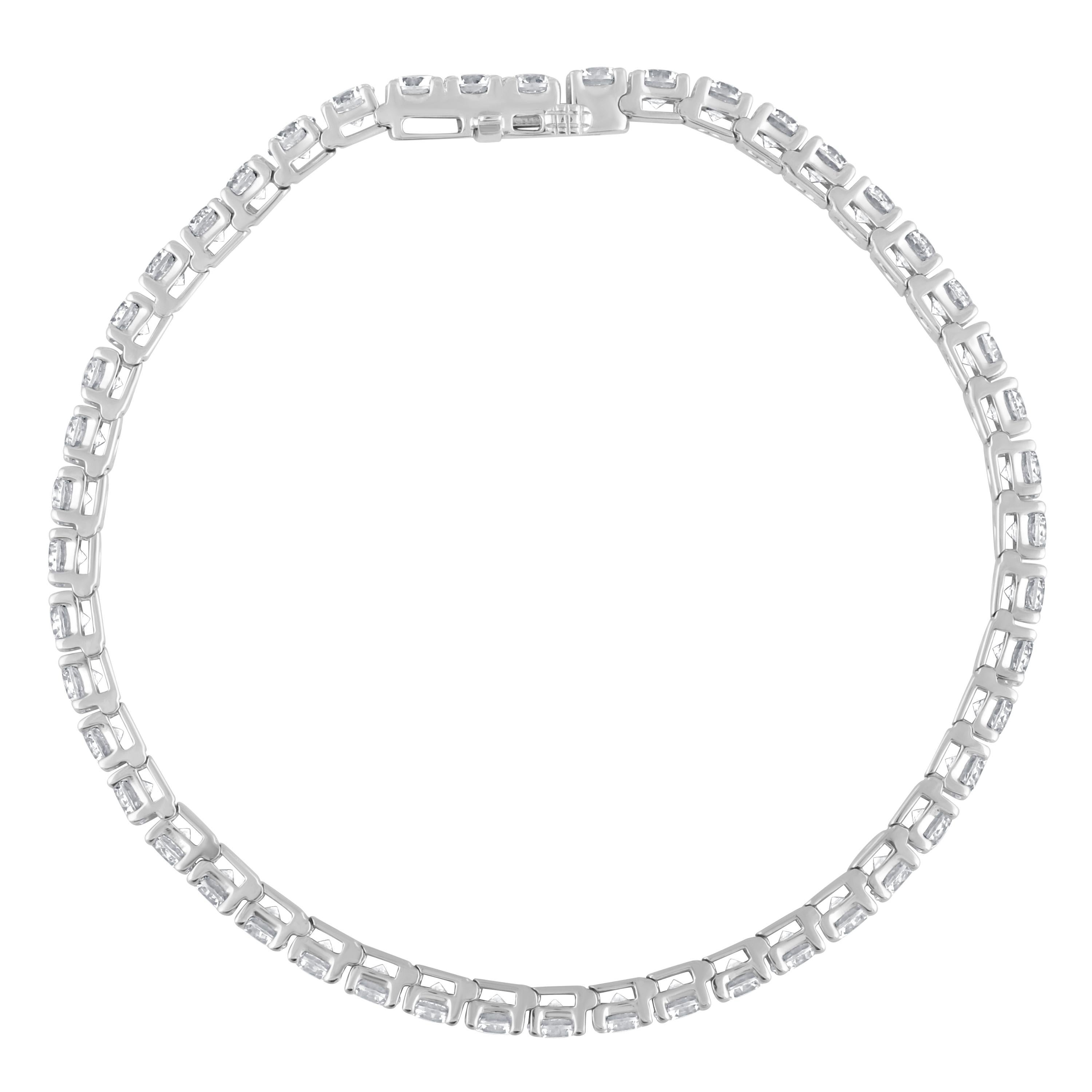 A perfect look just for her, this diamond tennis bracelet is certain to take her breath away. Fashioned in modern 14K white gold, this timeless design features an awe-inspiring 12 ctw. of prong-set round diamonds, each with a color ranking of I-J