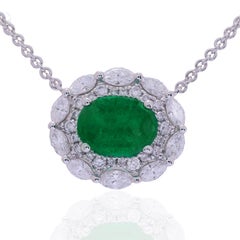 Ciondolo con smeraldo ovale da 1,2 carati 8x6 mm e diamante aureolato da 0,14 carati in 18W ref1364