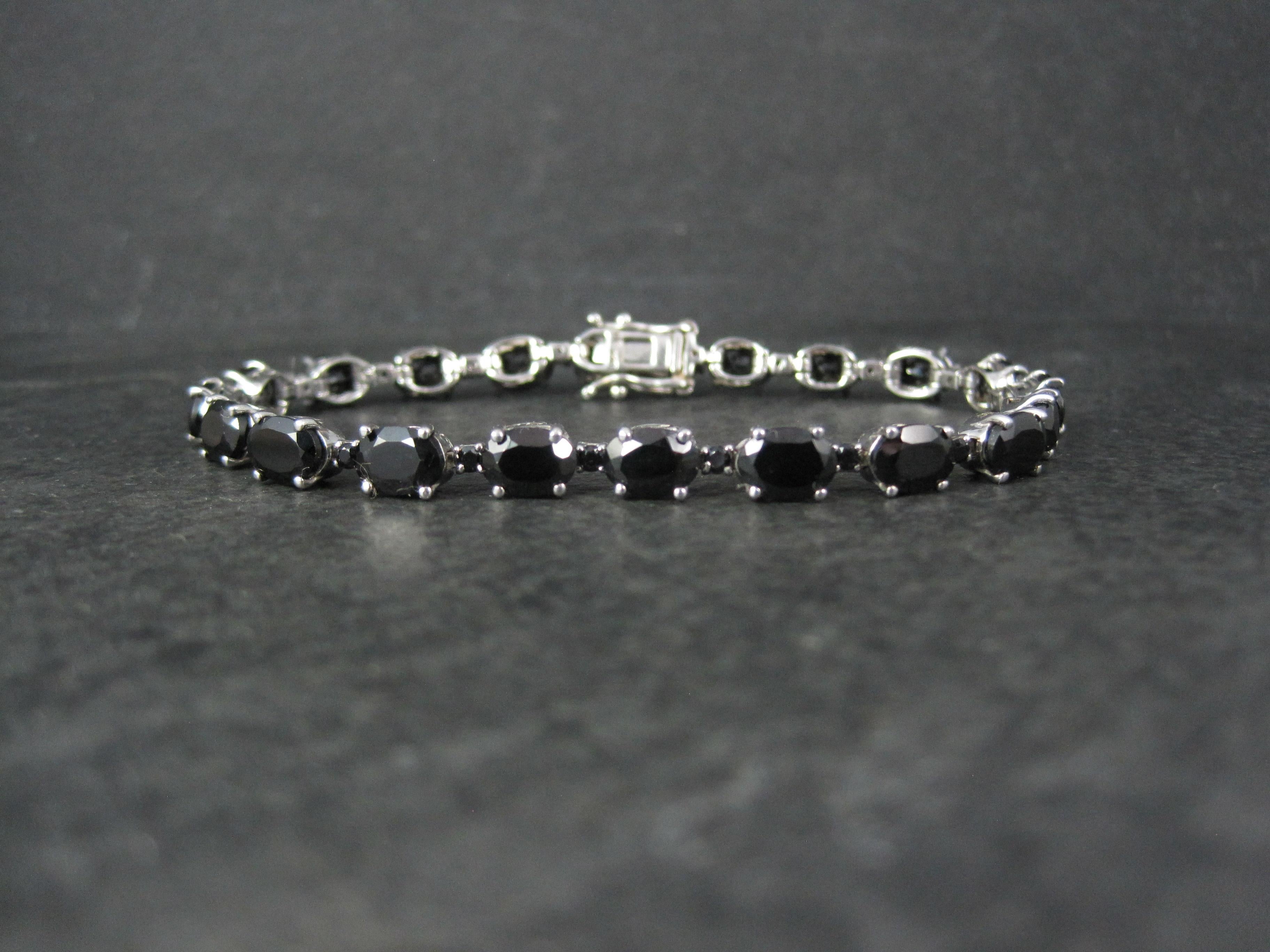 This gorgeous bracelet is sterling silver.
It features an estimated 12 carats in genuine black tourmaline gemstones.
The stones measure 5x7mm and 2mm.

This bracelet measures 1/4 of an inch wide and is 7 1/4 wearable inches.
Weight: 13.8