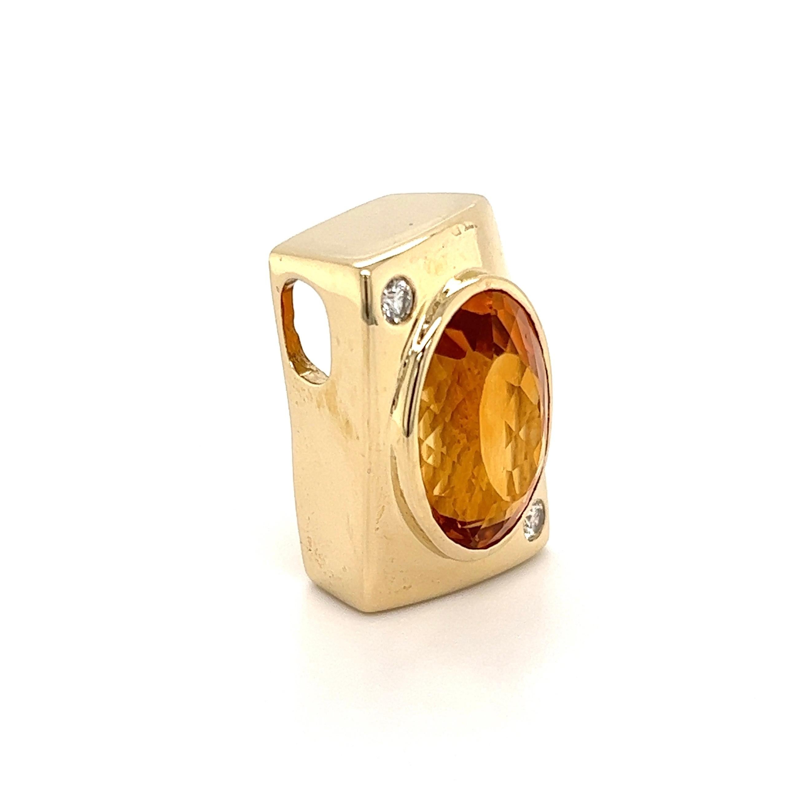 Simply Fabulous, Timeless and Finely detailed Citrine and Diamond Gold Slide Pendant. Centering a securely nestled 12Carat Citrine, accented by Diamonds weighing approx. 0.15tcw. Hand crafted 14K Yellow Gold mounting. Approx. dimensions: 1.00” l x