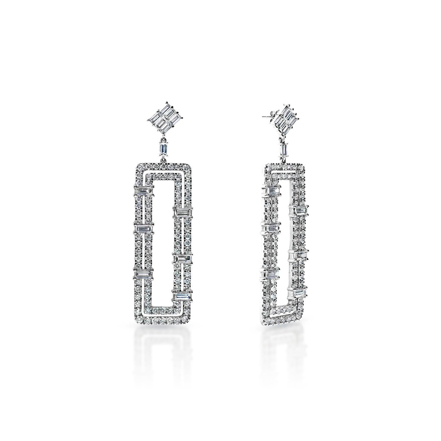 Diamond Hanging Earrings For Ladies:

Carat Weight: 11.89 Carats
Shape: Combined Mixed Shape (CMB)
Metal: 14Karat White Gold
Metal Weight: 22.40 Grams
Style: Hanging Earrings