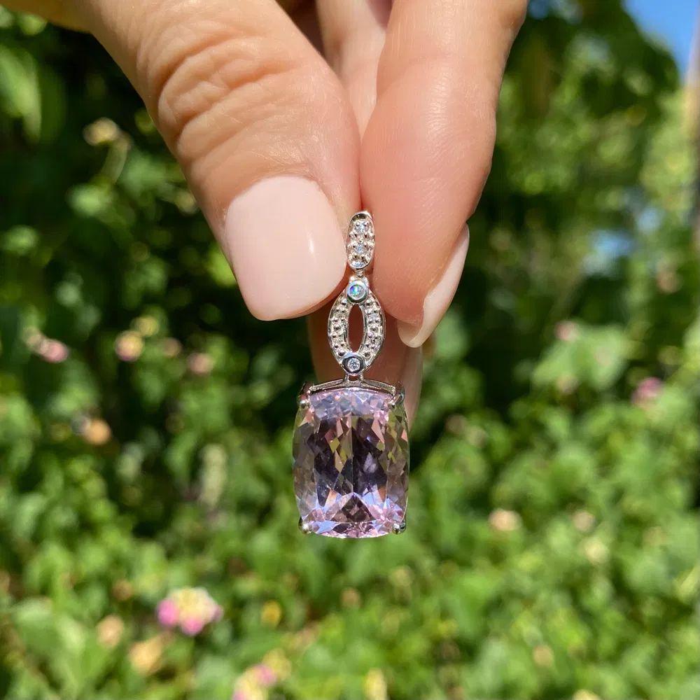 Simply Beautiful! Featuring an Awesome Cushion Kunzite, weighing approx. 12 Carats. Securely Hand set and accented by Diamonds. approx. 0.04tcw. Finely detailed Hand crafted 18K White Gold Pendant, measuring approx. 1.35” l x 0.48” w. Love this