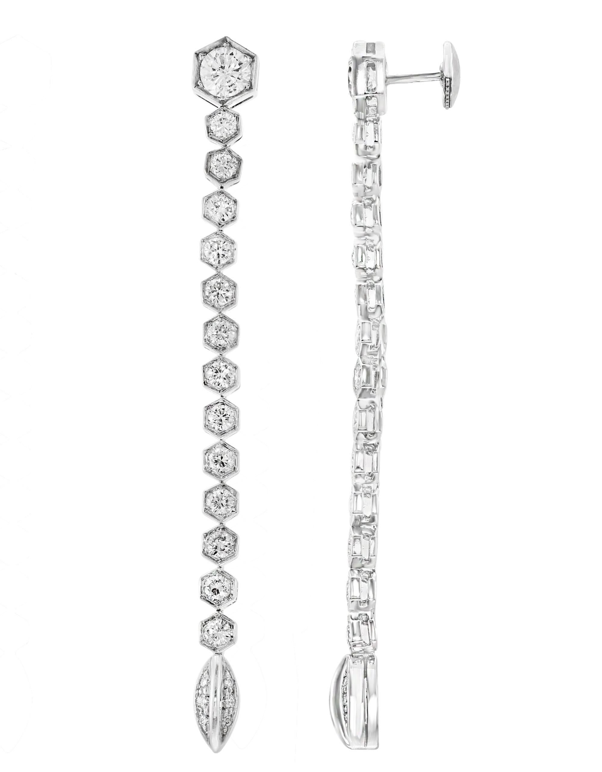 18 Karat white gold  necklace  and Earring suite.
 Round brilliant cut diamonds set in 4 rows  in the necklace.
The Necklace is made with round  diamonds with a total 12 carat   F-G color, VS1, VS2 clarity. Matching line Earring follows the same