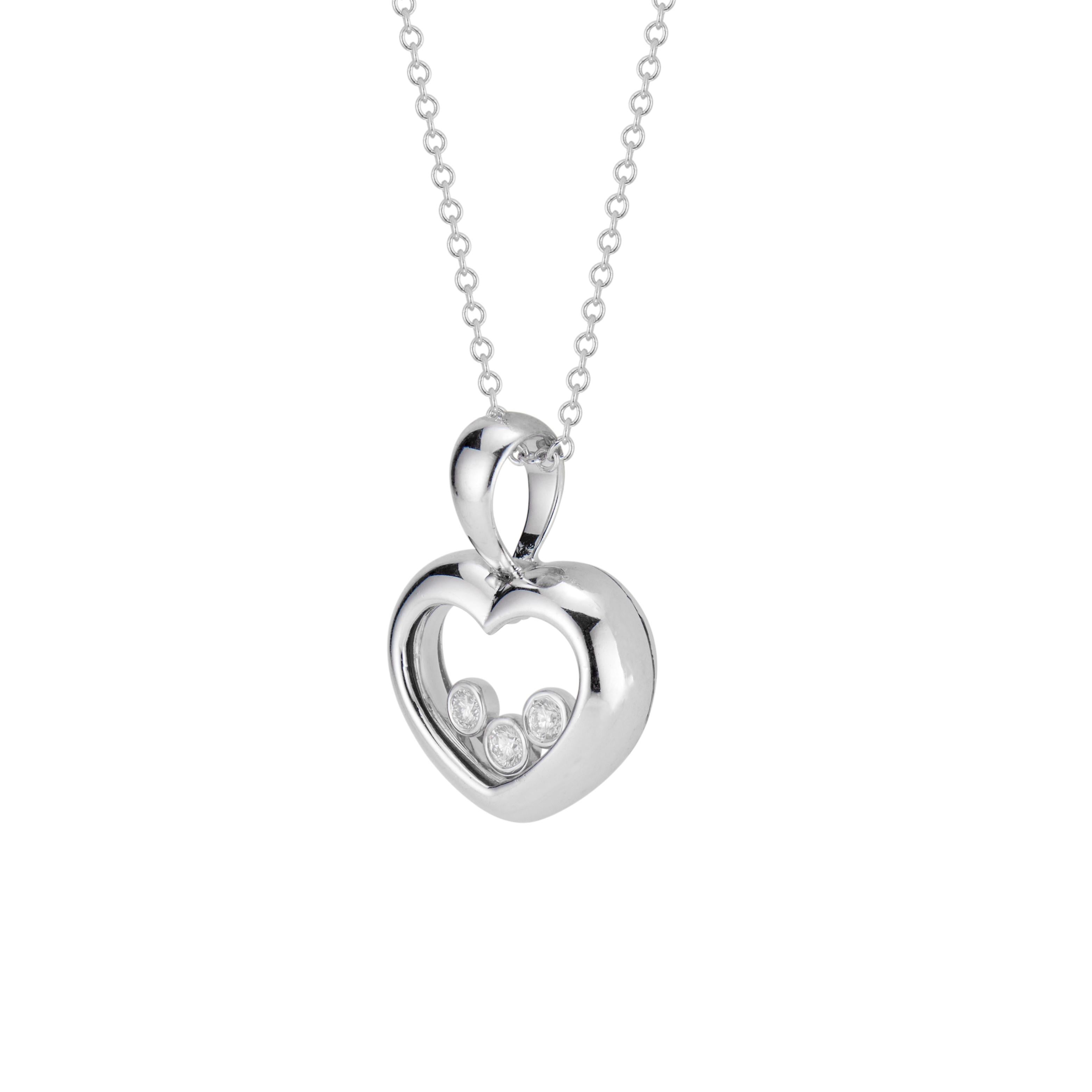 Open heart diamond pendant necklace. 18k white gold open heart pendant with three floating diamonds on a 16 Inch cable chain with lobster catch.

3 round brilliant cut diamonds, G-H VS approx. .12cts
18k white gold 
Stamped: 18k
6 grams 
Top to