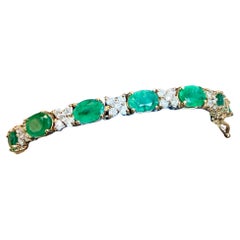 12 Carat Emerald 2.2 Carat Diamond Flower Tennis Bracelet 14 Karat Yellow Gold