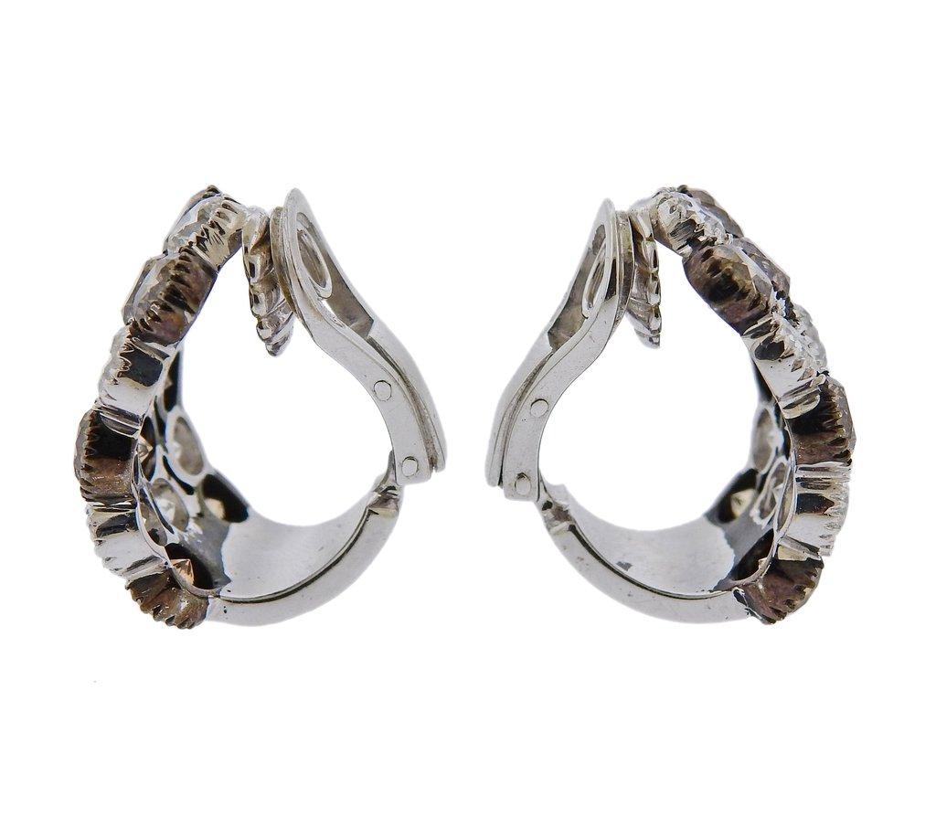 Amazing 18k white gold half earrings, set with a total of approximately 12 carats in white SI/HI and fancy brown diamonds. Earrings are 23mm x 16mm. Weight is 22.6 grams. Marked 750.