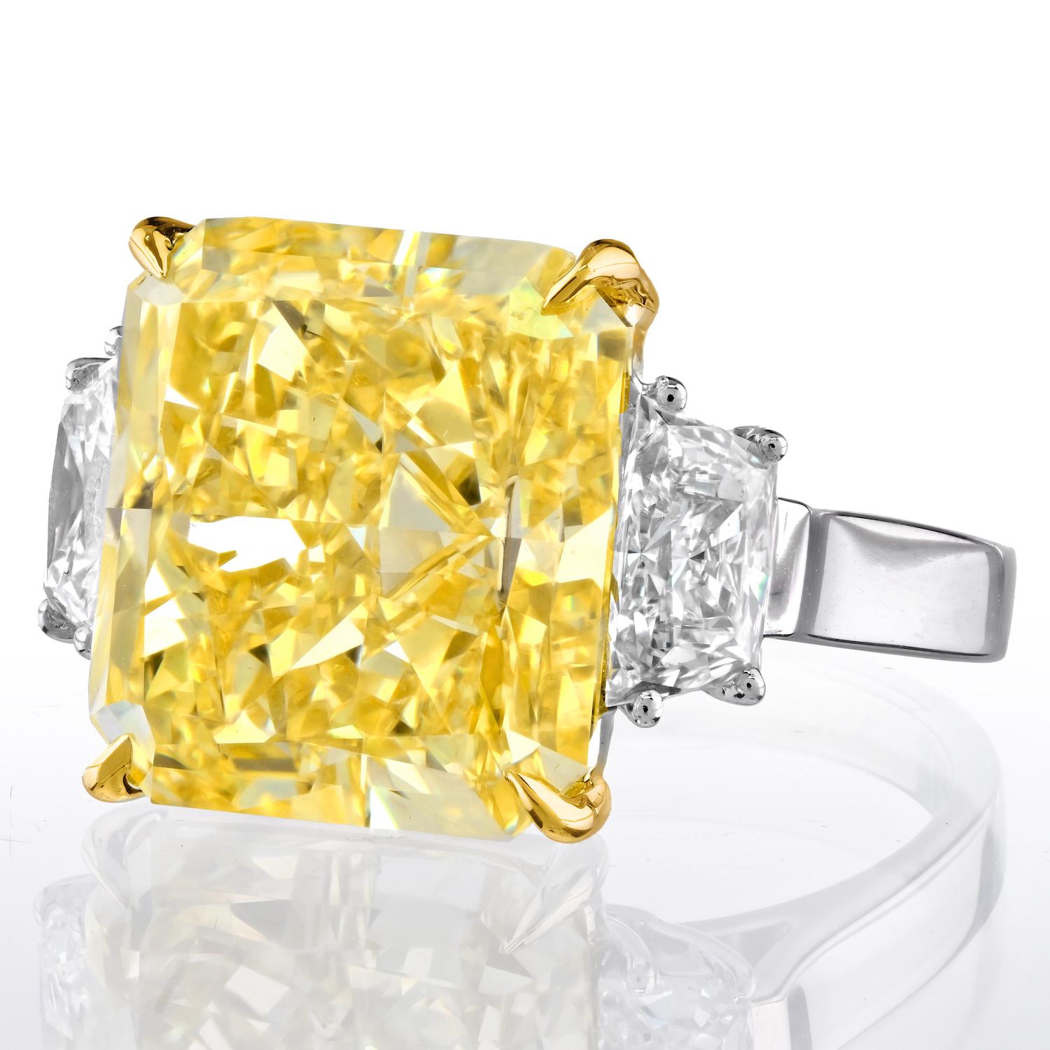 Modern 12 Carat Fancy Intense Yellow VS1 Radiant Cut Diamond Three Stone Platinum Ring For Sale