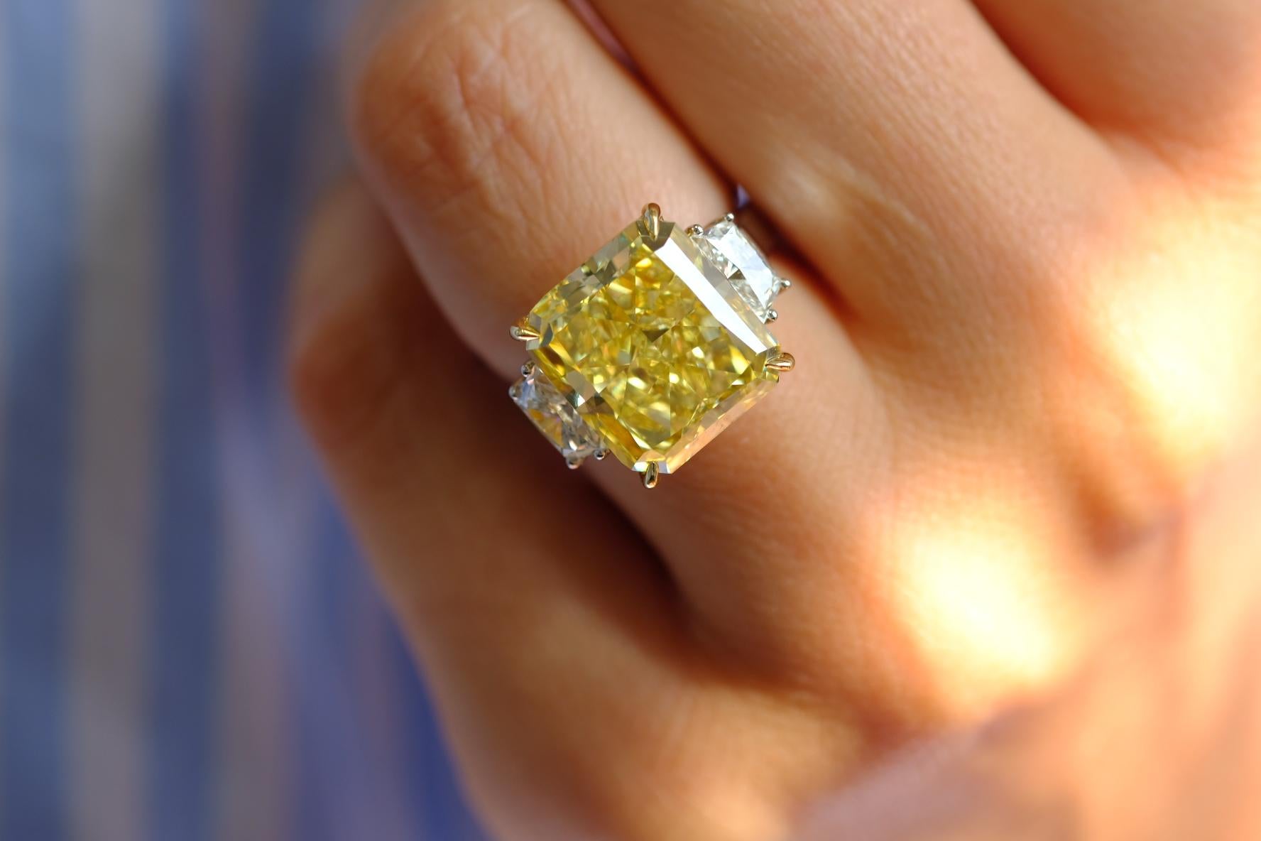 12 Carat Fancy Intense Yellow VS1 Radiant Cut Diamond Three Stone Platinum Ring For Sale 1