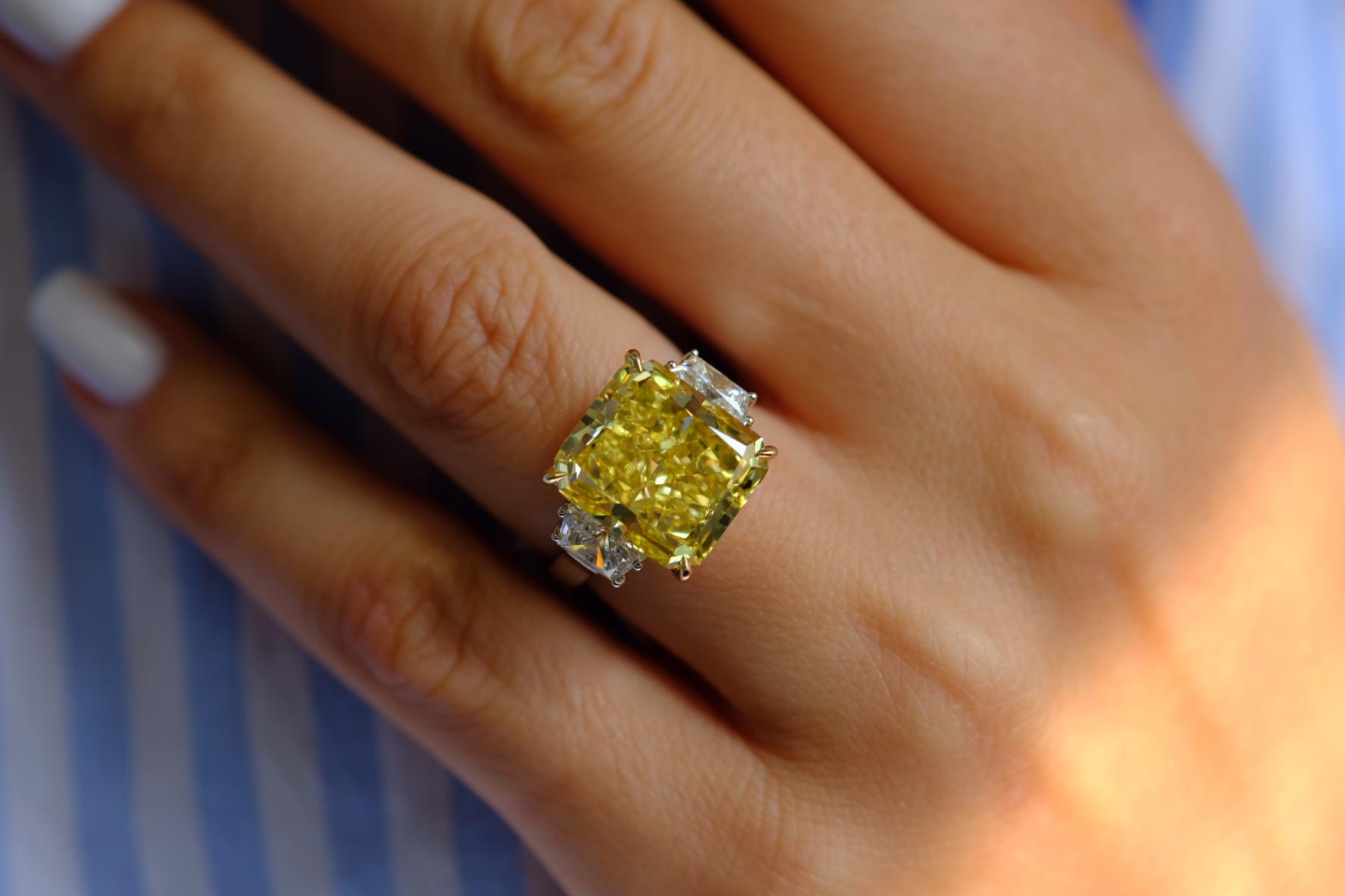 12 Carat Fancy Intense Yellow VS1 Radiant Cut Diamond Three Stone Platinum Ring For Sale 2