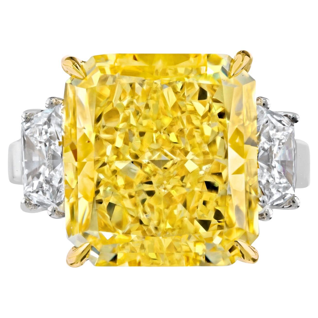 12 Carat Fancy Intense Yellow VS1 Radiant Cut Diamond Three Stone Platinum Ring For Sale