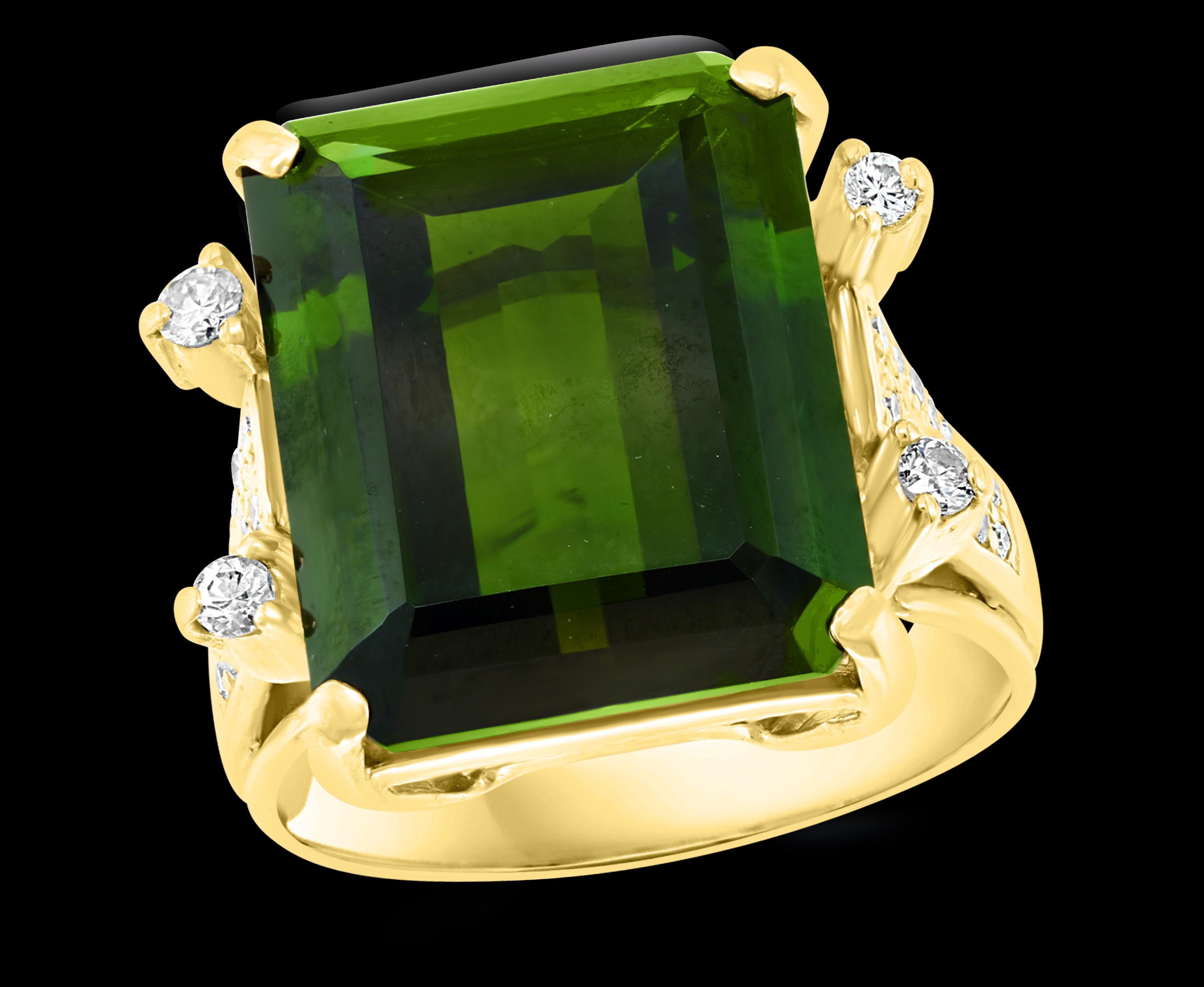Approximately 12 + Carat Green Tourmaline and 0.50 Ct Diamond Cocktail Ring 18 K Yellow Gold 
A classic, Cocktail ring 
Measurements  of the stone is 15X 13 which is over 12 ct
Huge 12+ Carat of very clean Nice  Green Tourmaline full of luster and