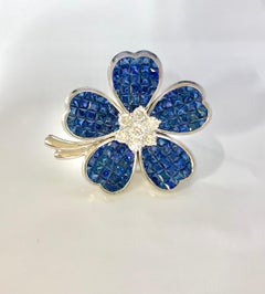 12 Carat Invisible Set Ceylon Sapphire and Diamond Flower Brooch